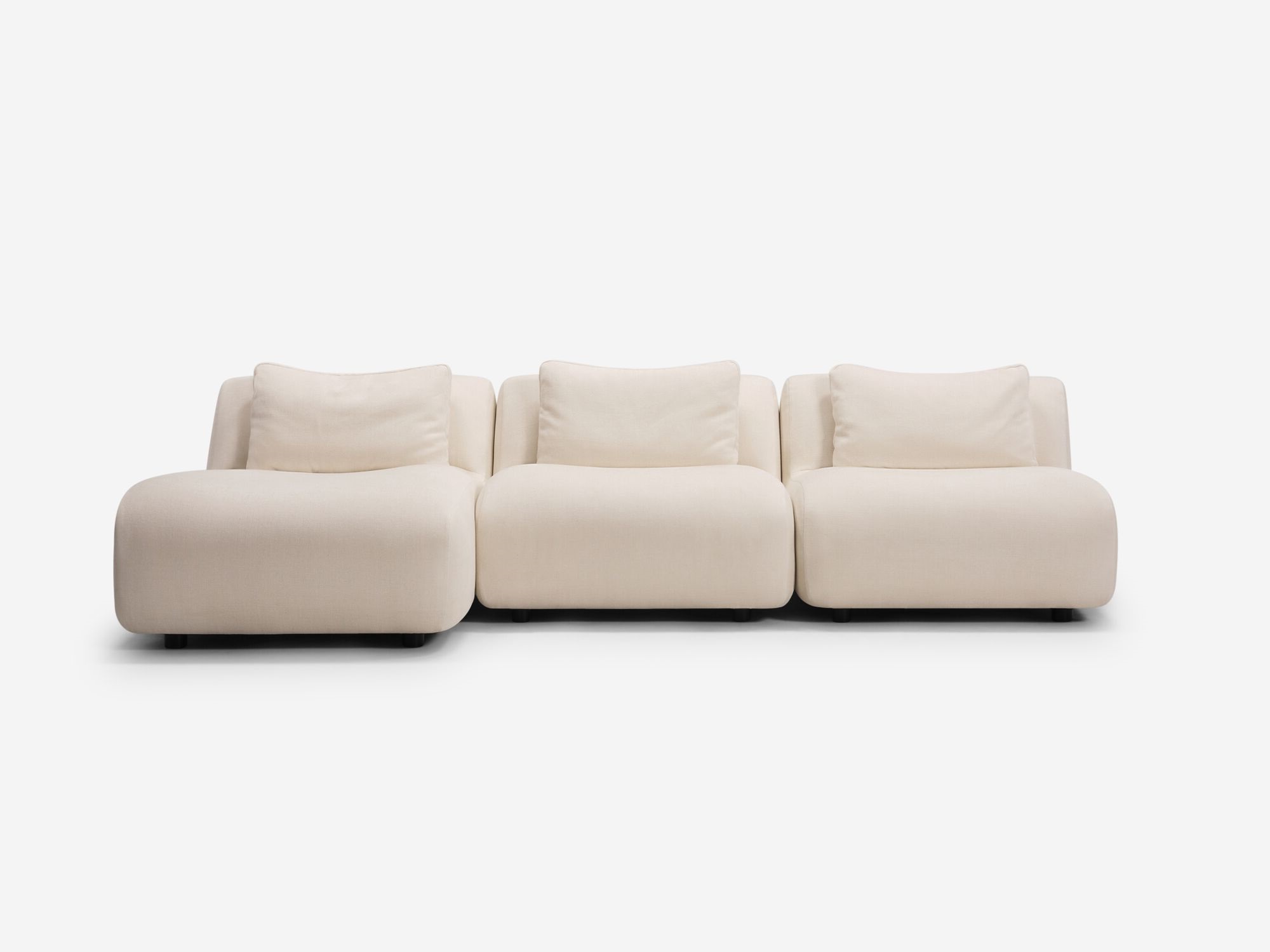 Beige armless left hand facing sectional front view