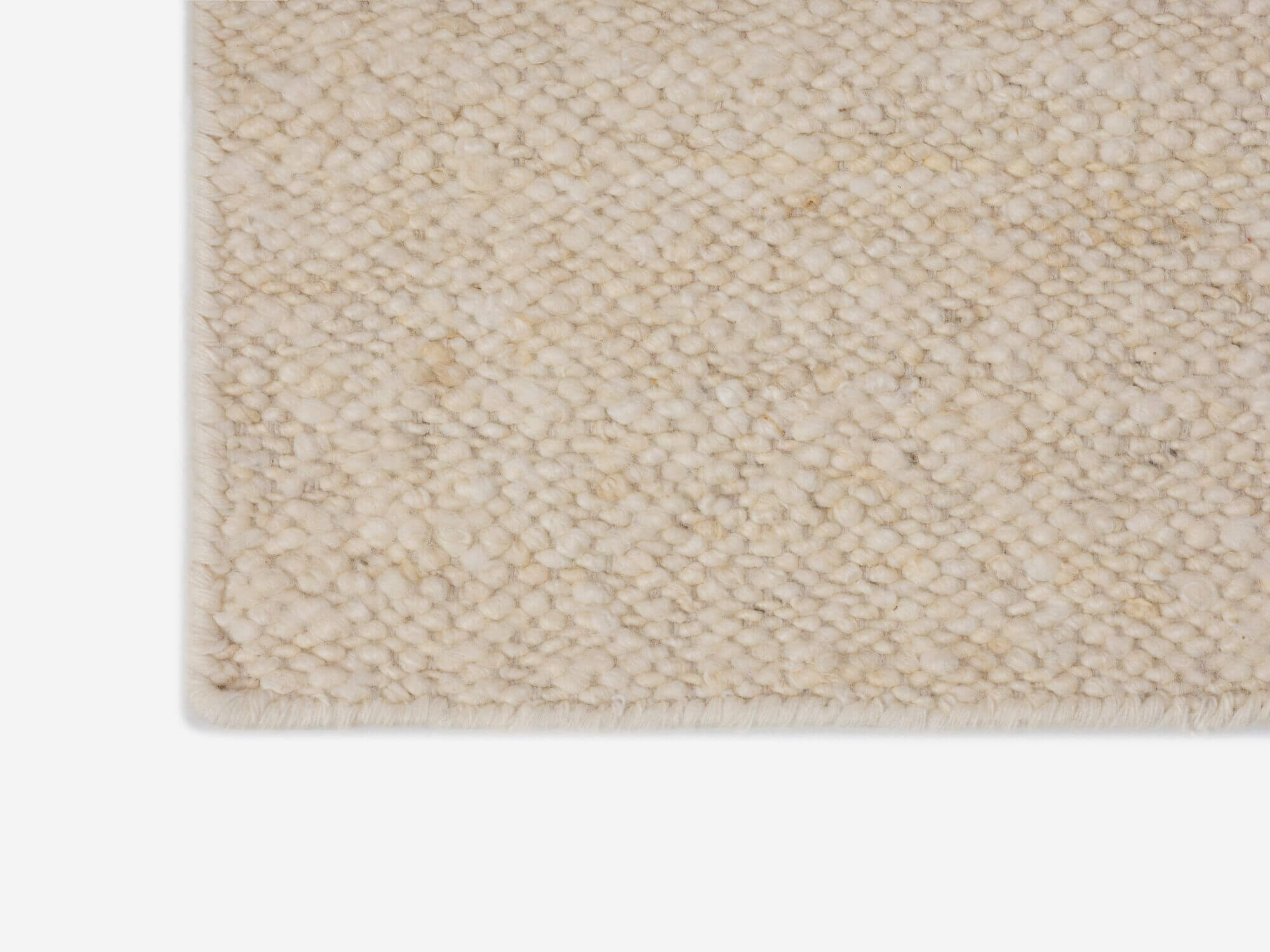 Corner view of braided beige hallway runner