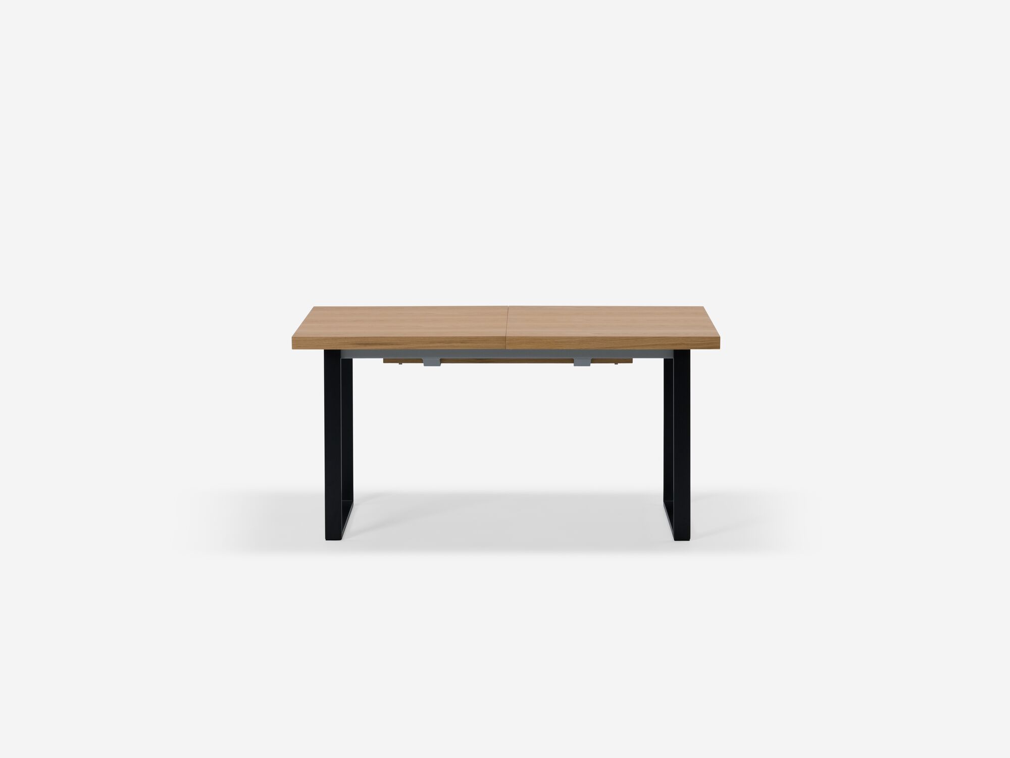 Expandable dining table with black legs and oak top side view