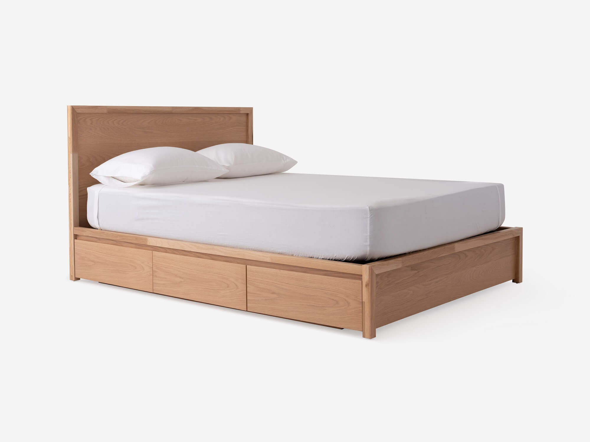 https://images.eq3.com/image-service/c988e07f-04ea-462f-a812-5c7772b1ae42/angled-view-of-marcel-drawer-storage-bed-in-oak_COMPRESSED.jpg