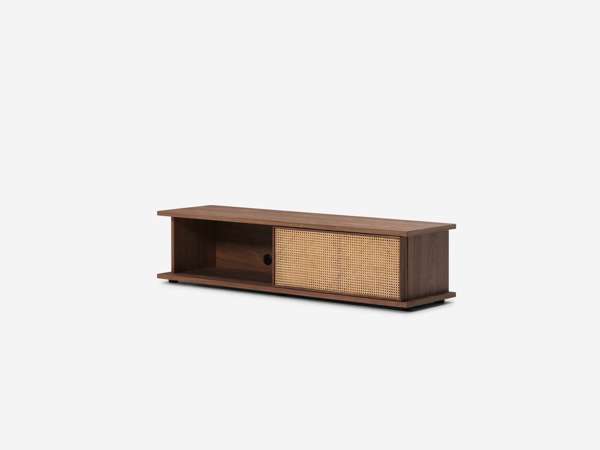 Low walnut media unit with open natural cane doors front angle view