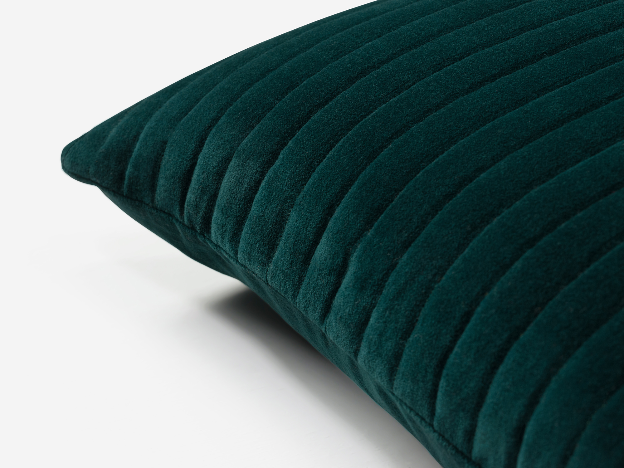 Green velvet accent pillow corner detail view