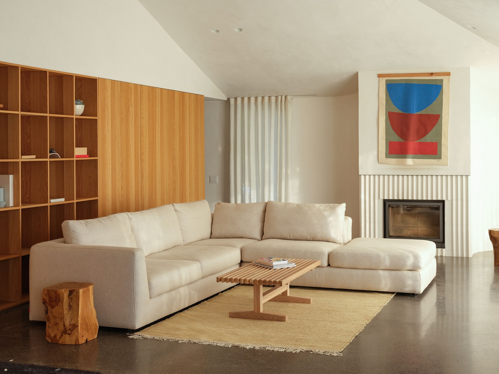 Beige sectional in mid century modern living space