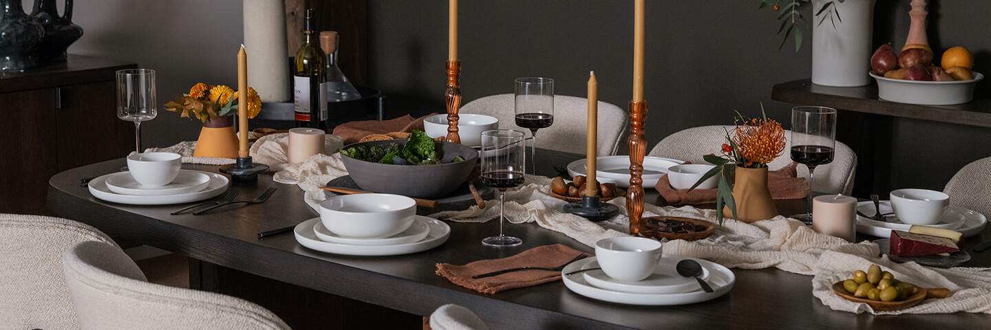 Dining accessories are displayed on black dining table