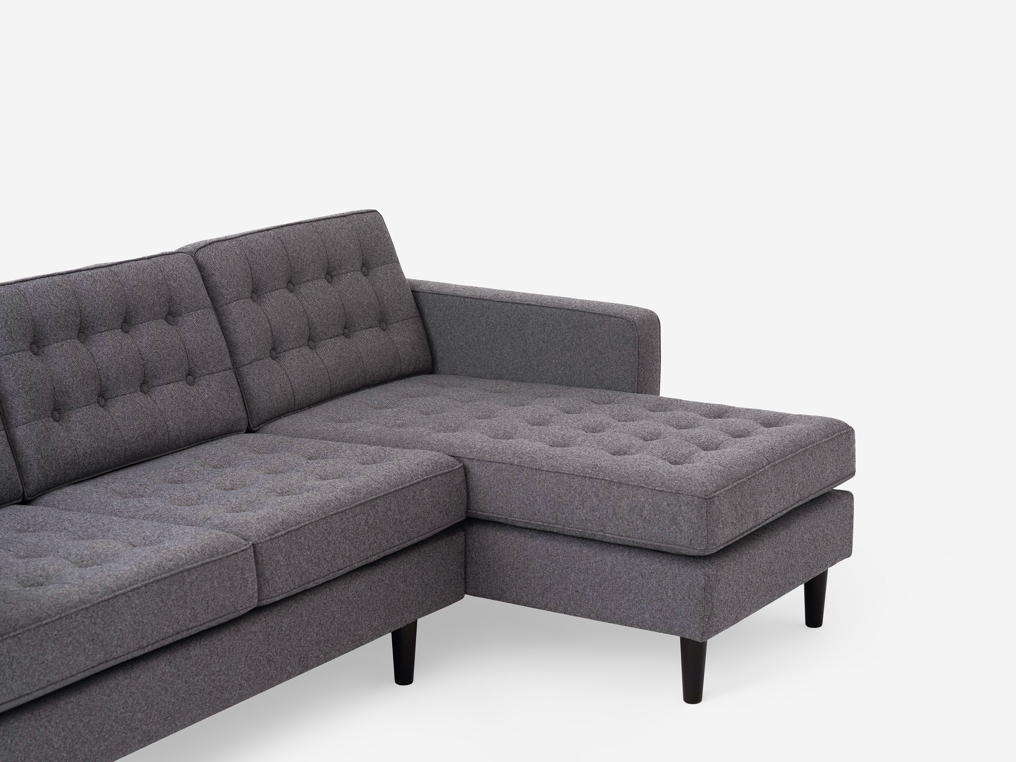 Detail view of the  Reverie modern sectional sleeper couch in gray fabric