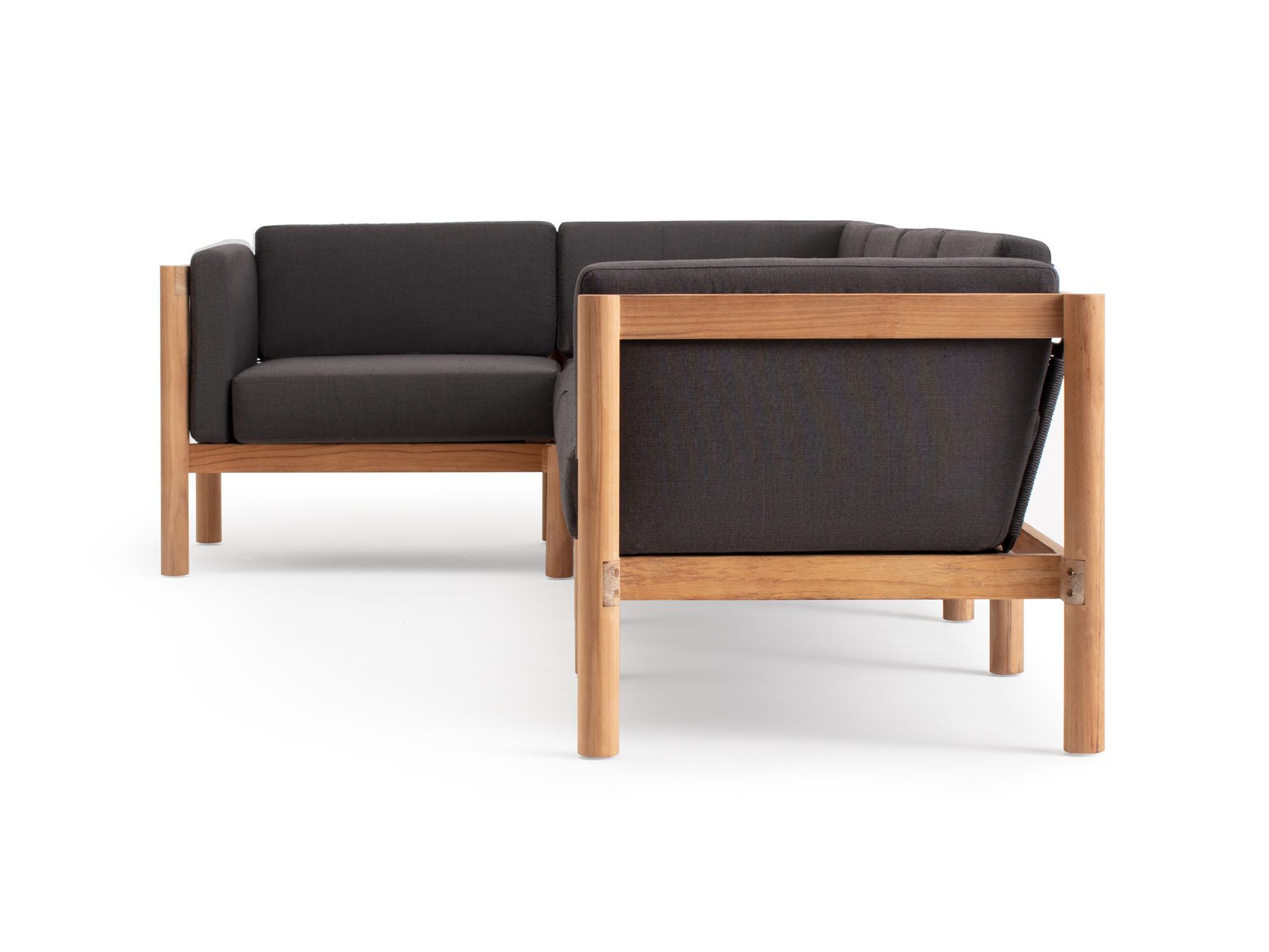 Side view of 5-piece outdoor sofa with black arm cushions