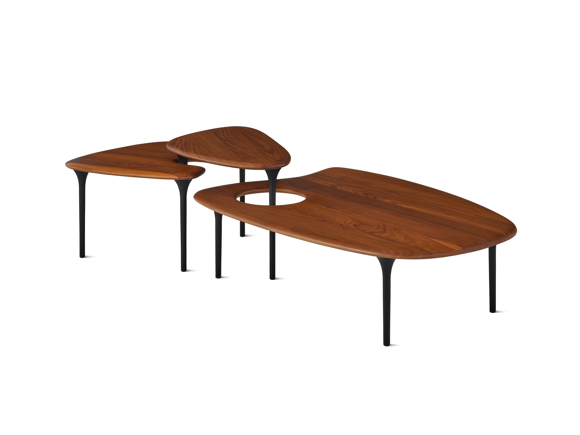 Three walnut topped accent tables arranged together