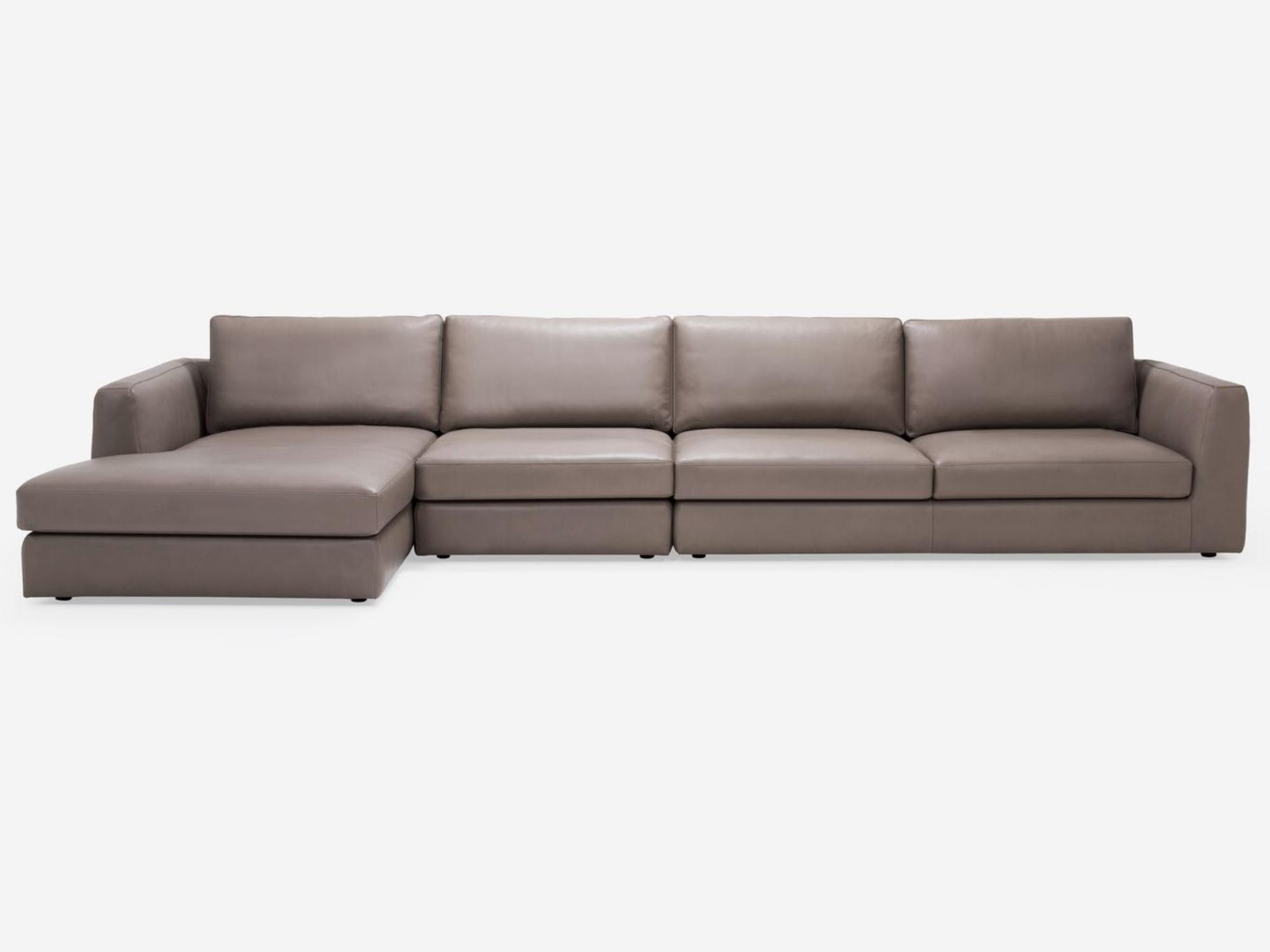 Front view of the modular sofa in beige leather with left hand chaise