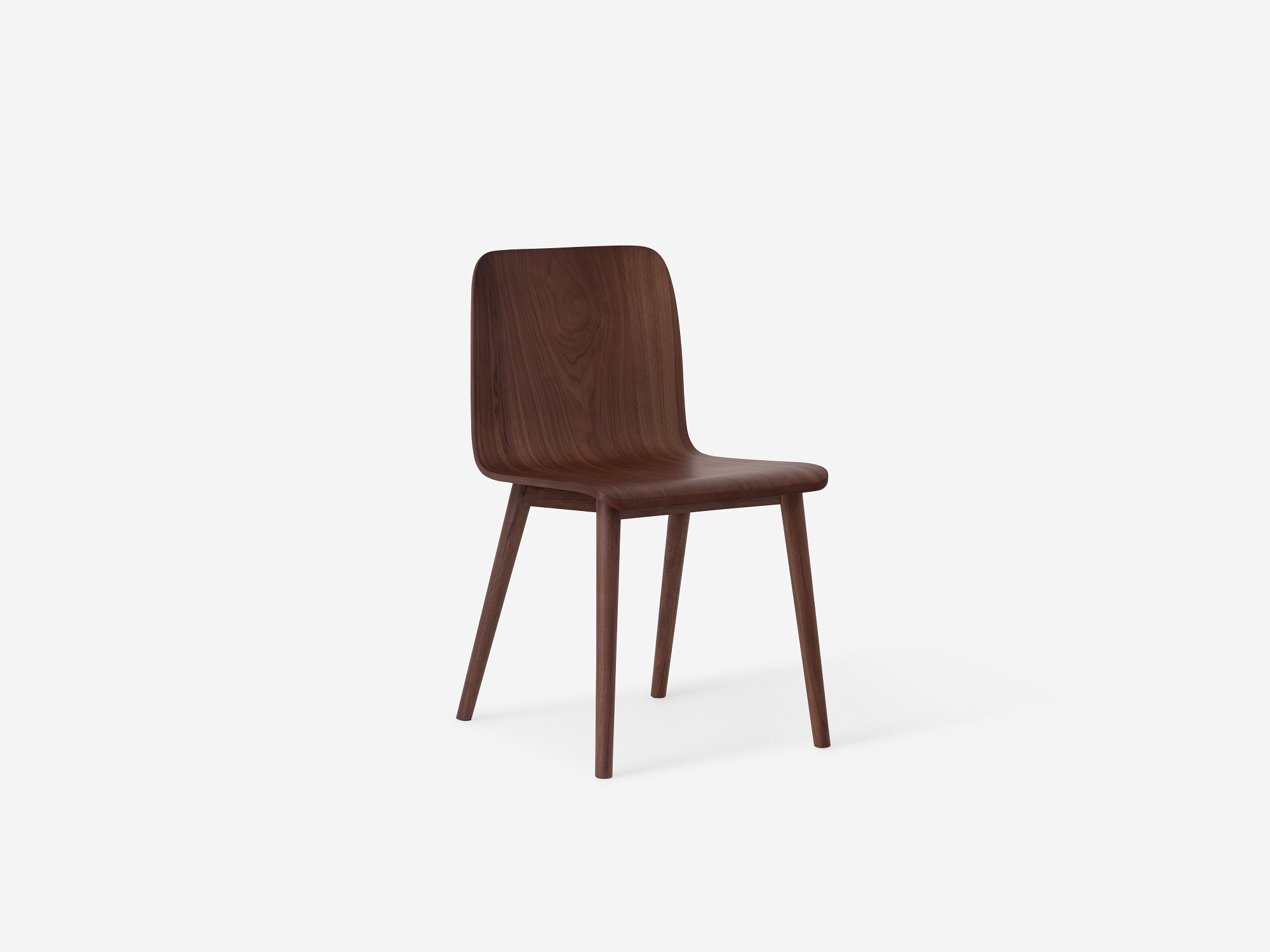 Angled view of the Tami mid century dining chair in walnut