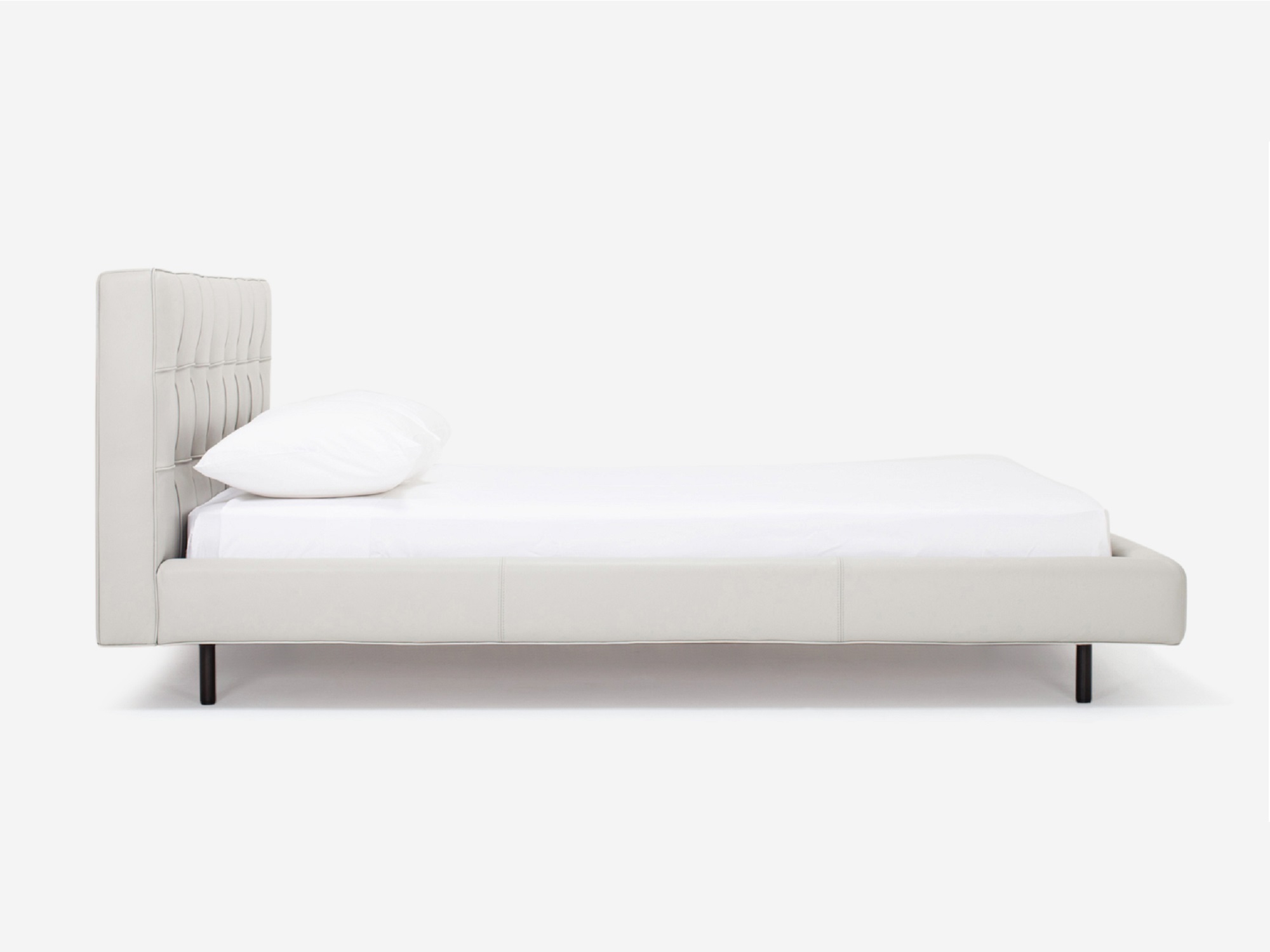 Side view of Winston, the mid century modern bed, in pale grey leather