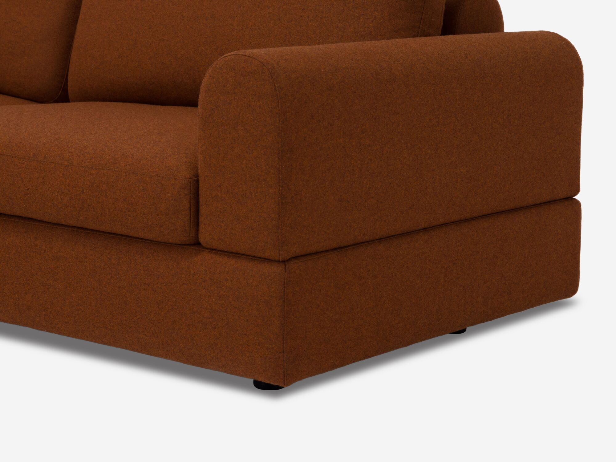 Front angle detail leg view of burnt orange sectional sofa