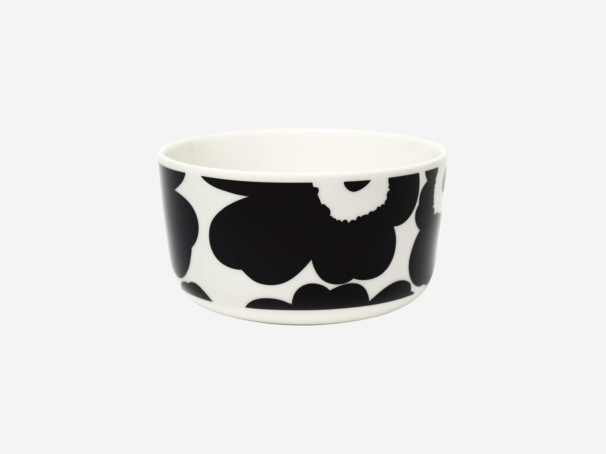 Side view of the Marimekko Oiva Unikko bowl in white and black 250 ml size