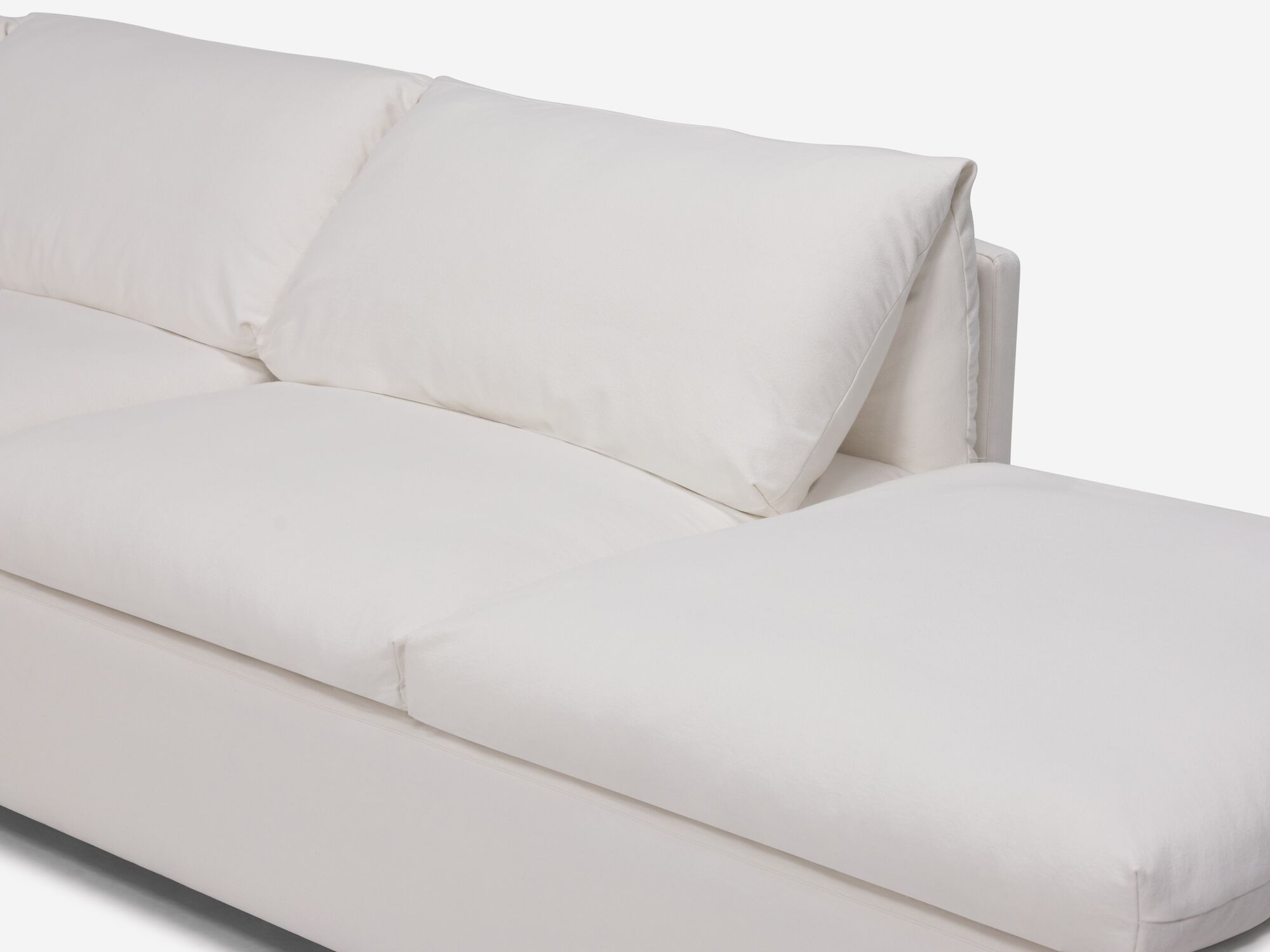 White sectional sofa with narrow arms and right hand chaise detail chaise view