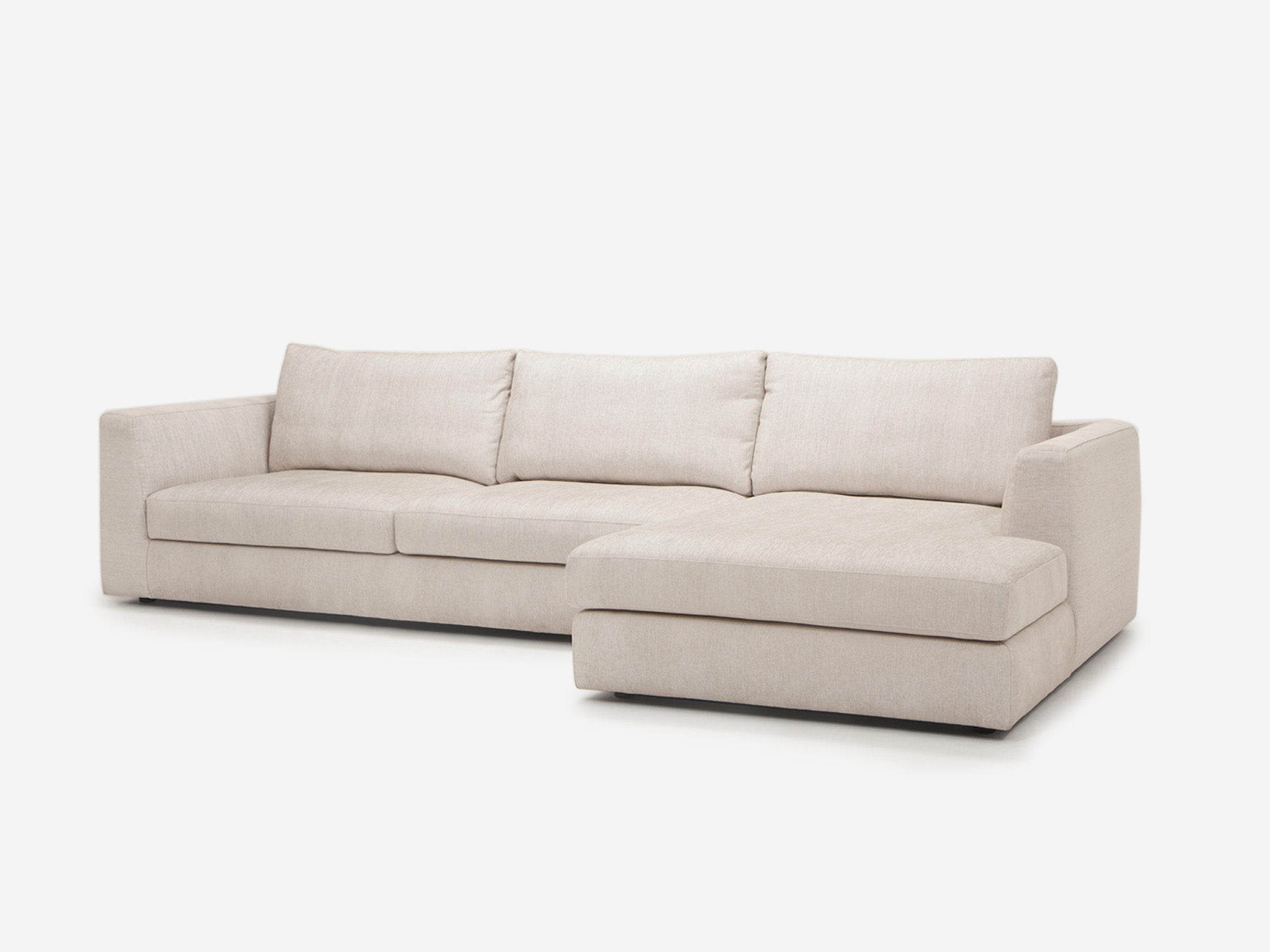 Angled view of the 2 piece sectional sofa in a white fabric