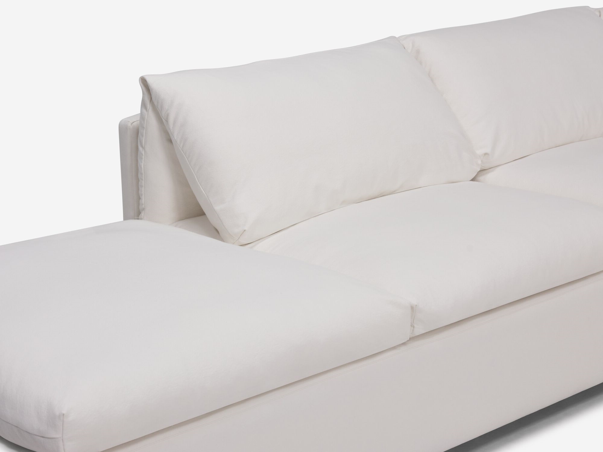 Chaise detail view of white sectional sofa