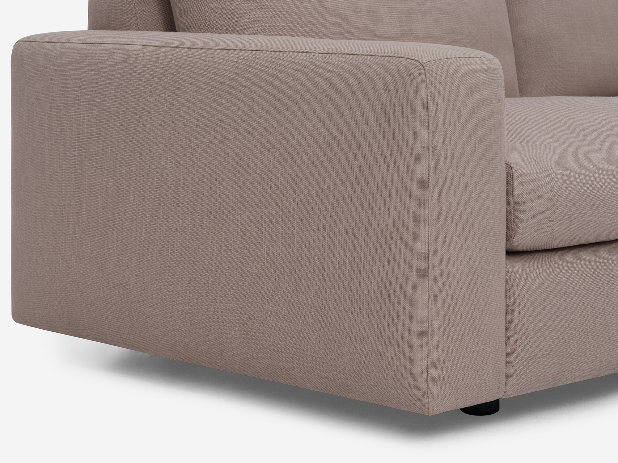 Detail side view of grey fabric loveseat with narrow arms