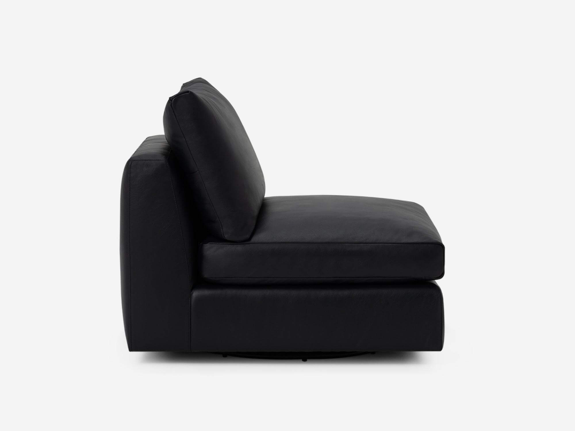 Side view of black leather armless chair