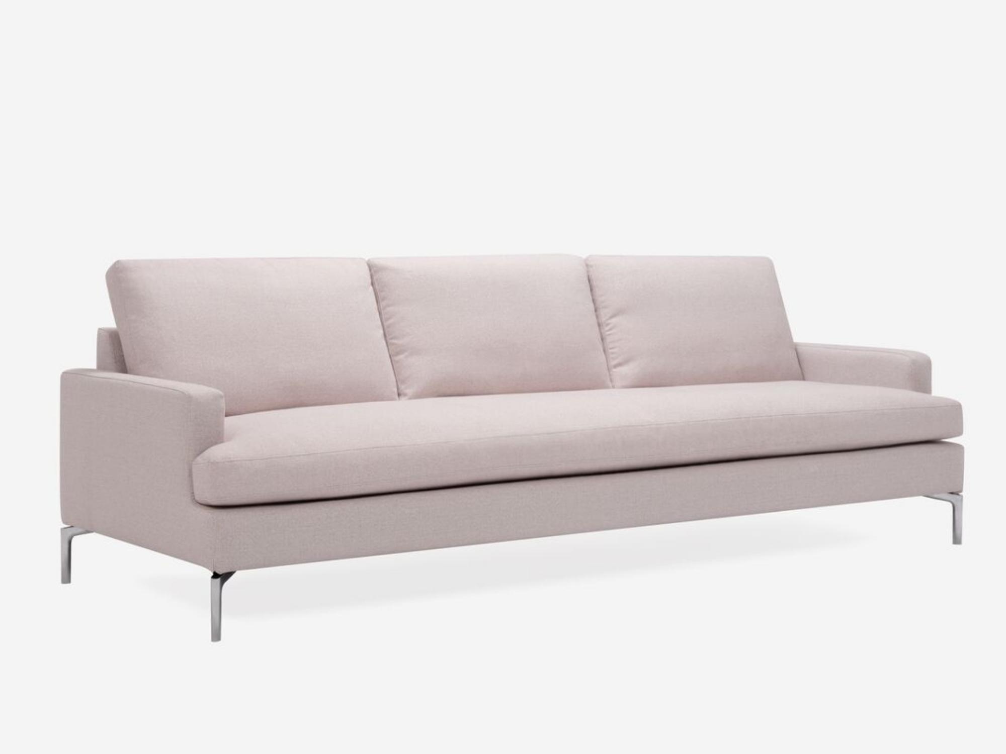 Angled view of the mid century modern Eve Sofa in white fabric