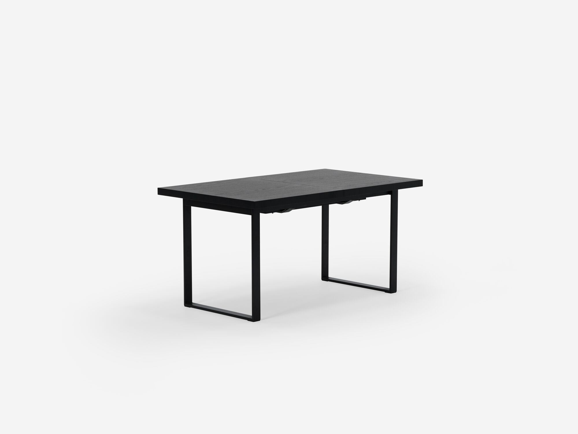 Expandable dining table with black legs and black top corner view