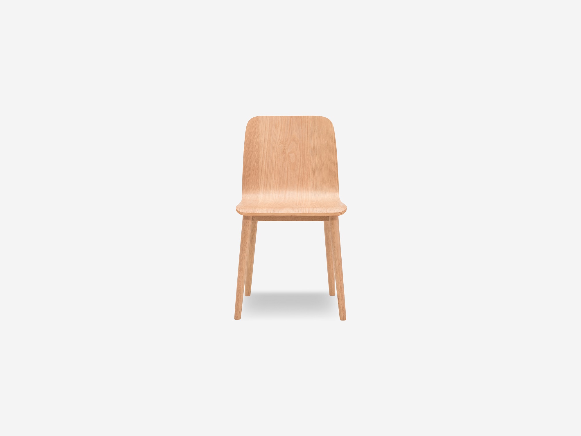 Front view of the Tami mid century dining chair in light oak