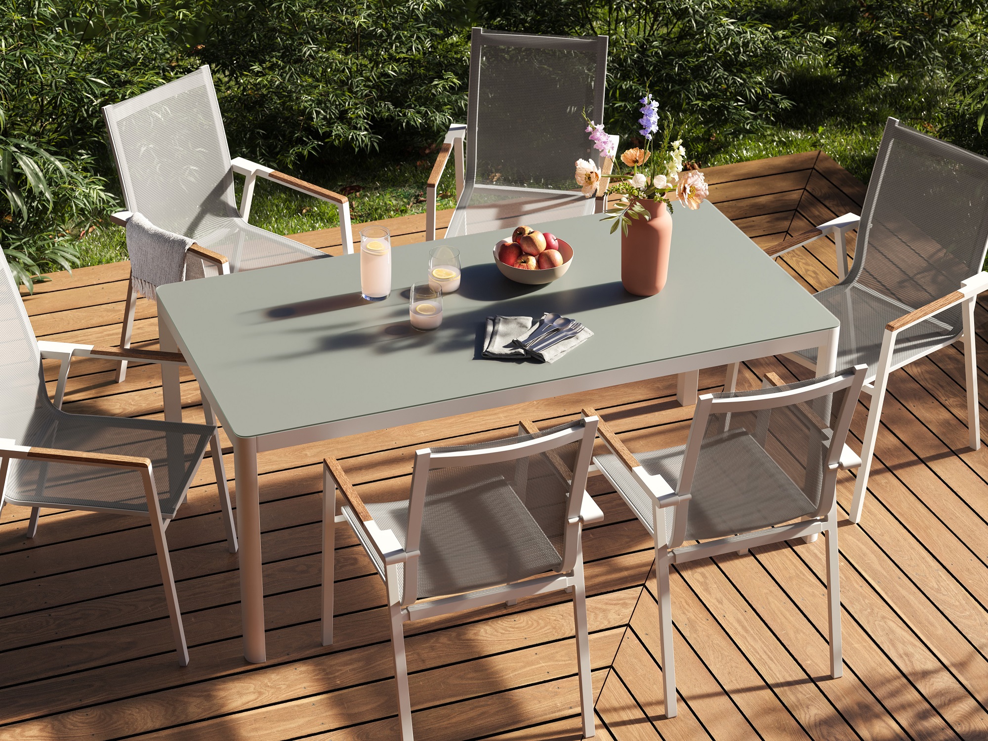 White and grey outdoor dining table with six outdoor dining chairs around it