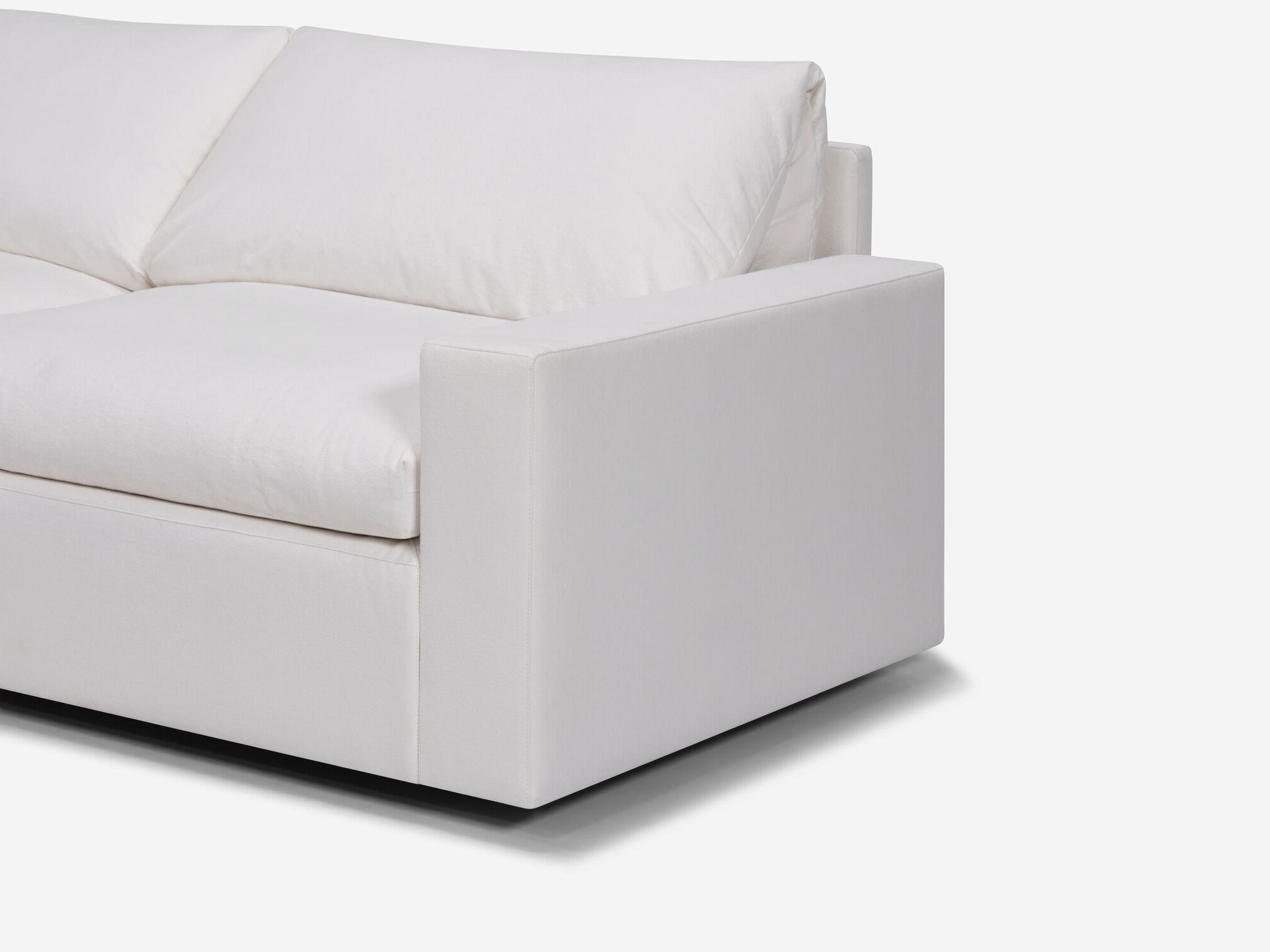 Seat detail view of white sectional sofa with left hand chaise