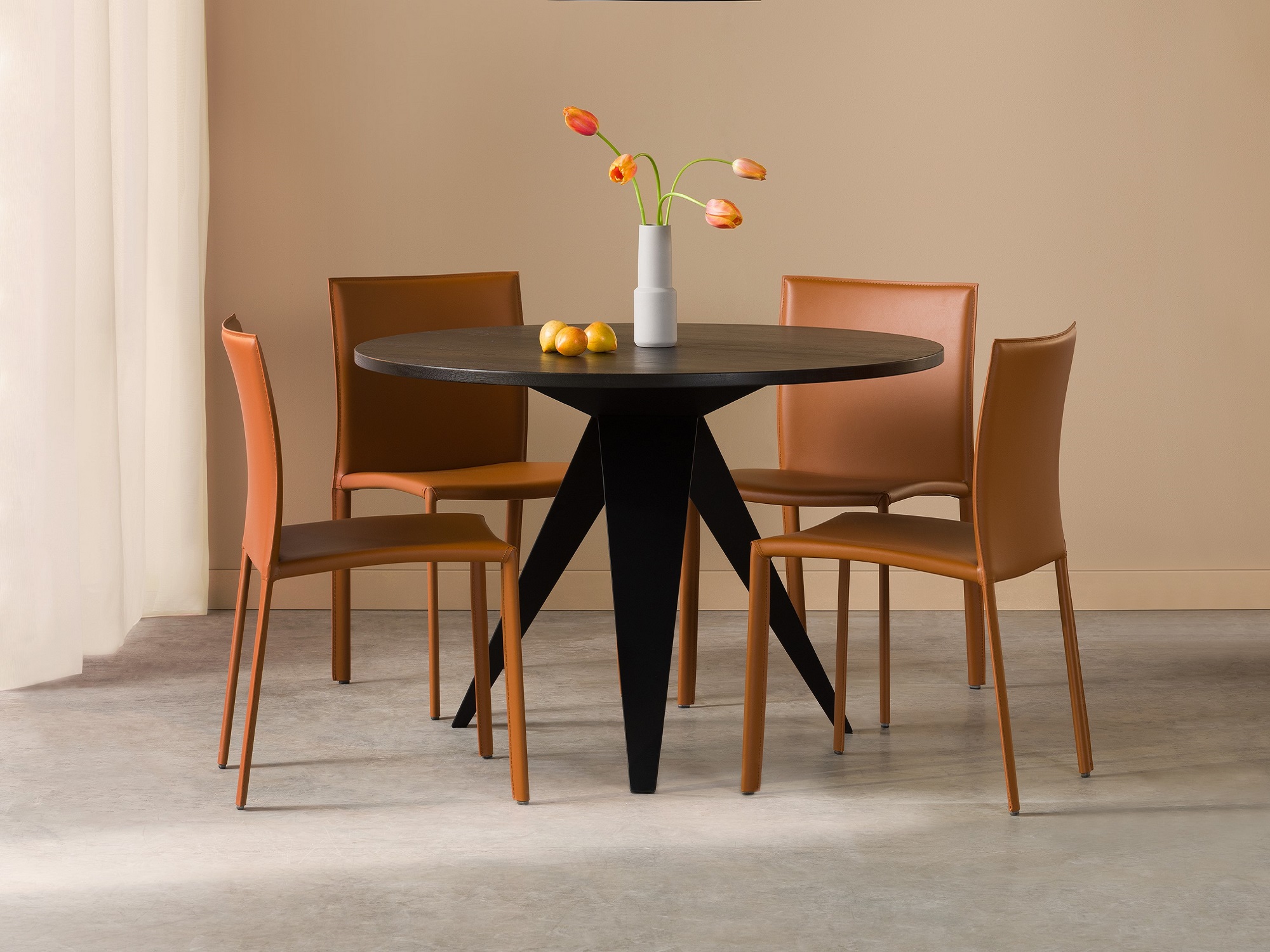 Brown dining chairs at modern black dinette table