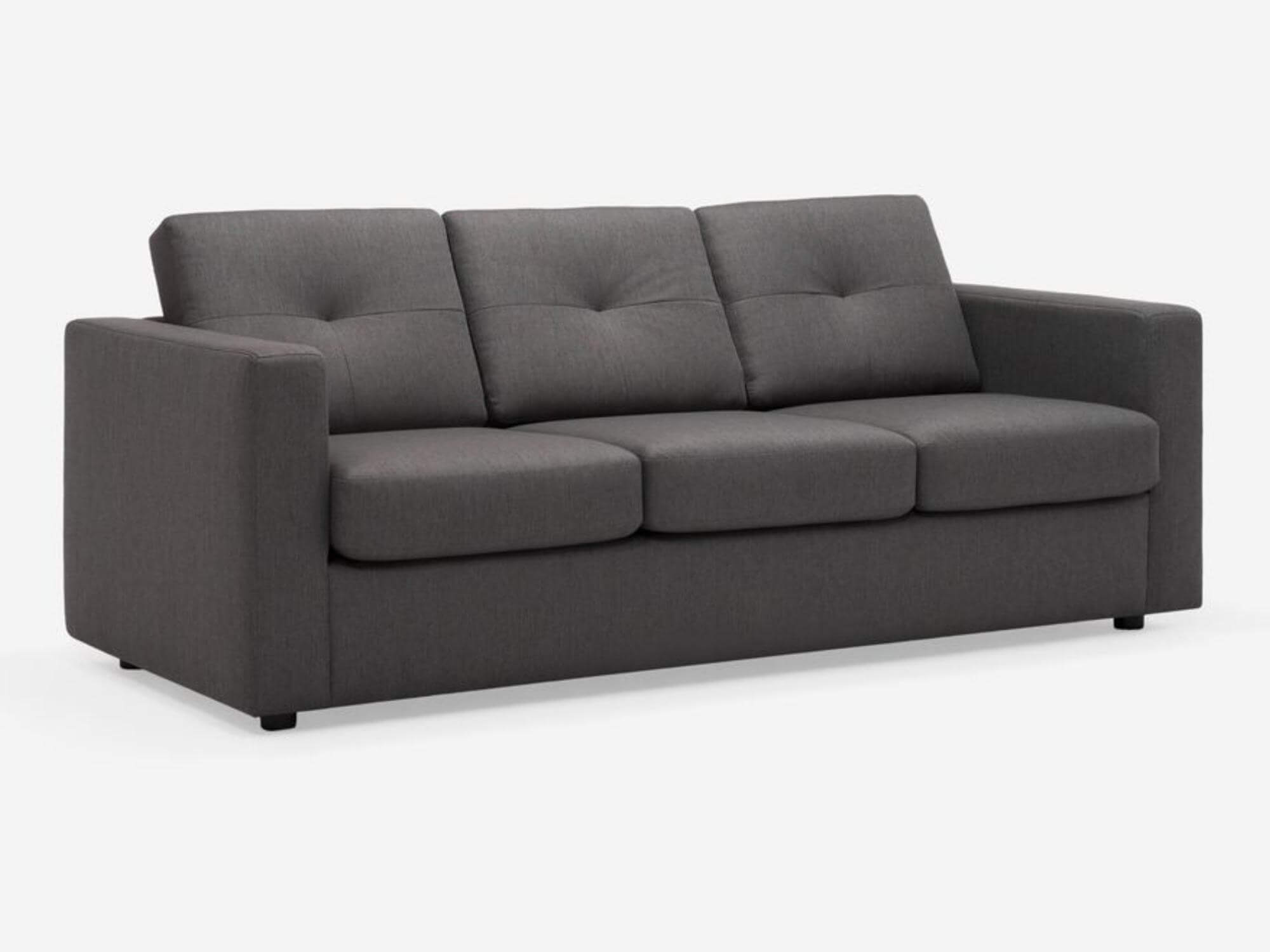 Angled view of the Solo sleeper couch in dark gray fabric