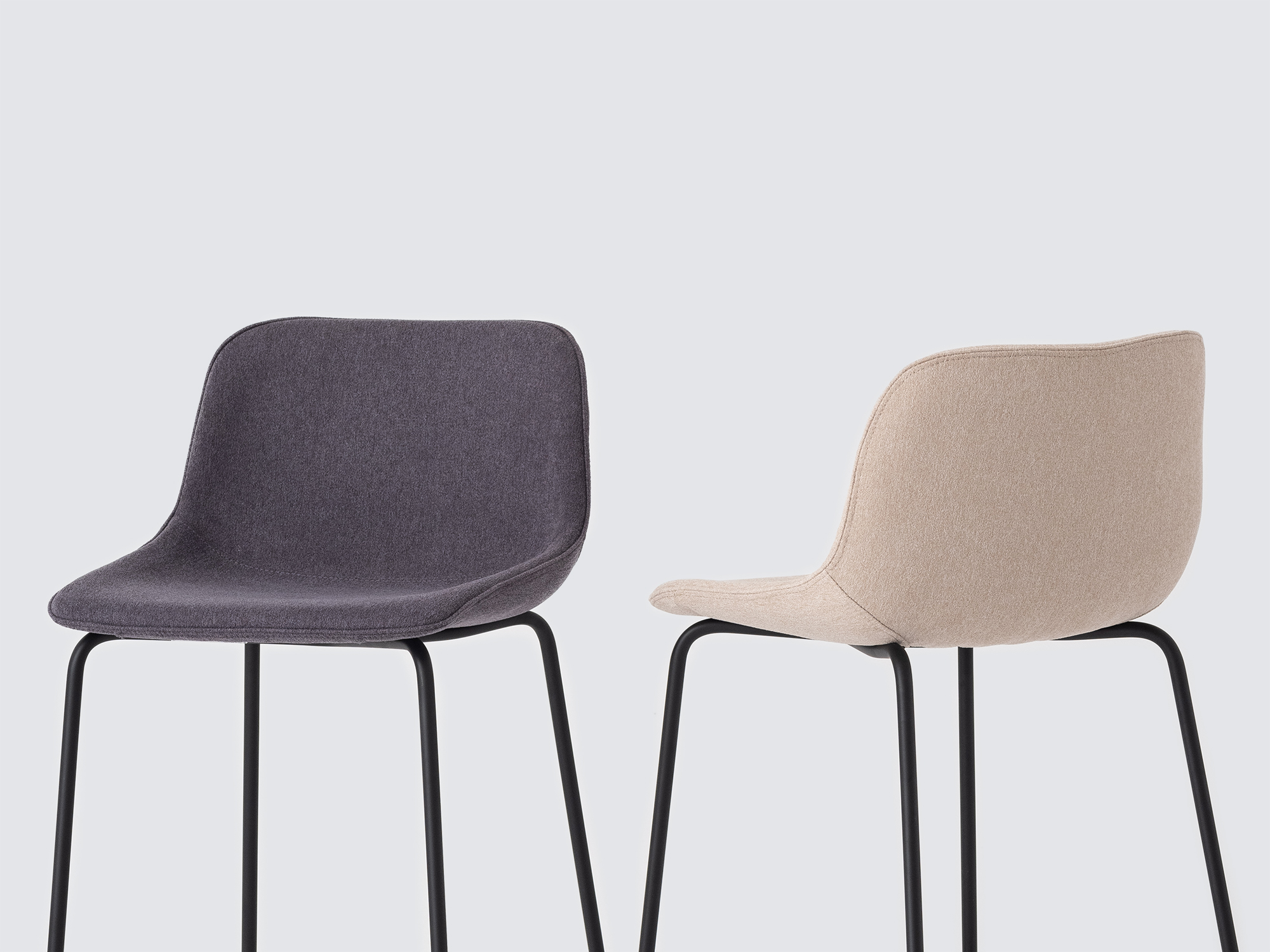 Detail view of two of the Oles counter height bat stool with grey and beige seats