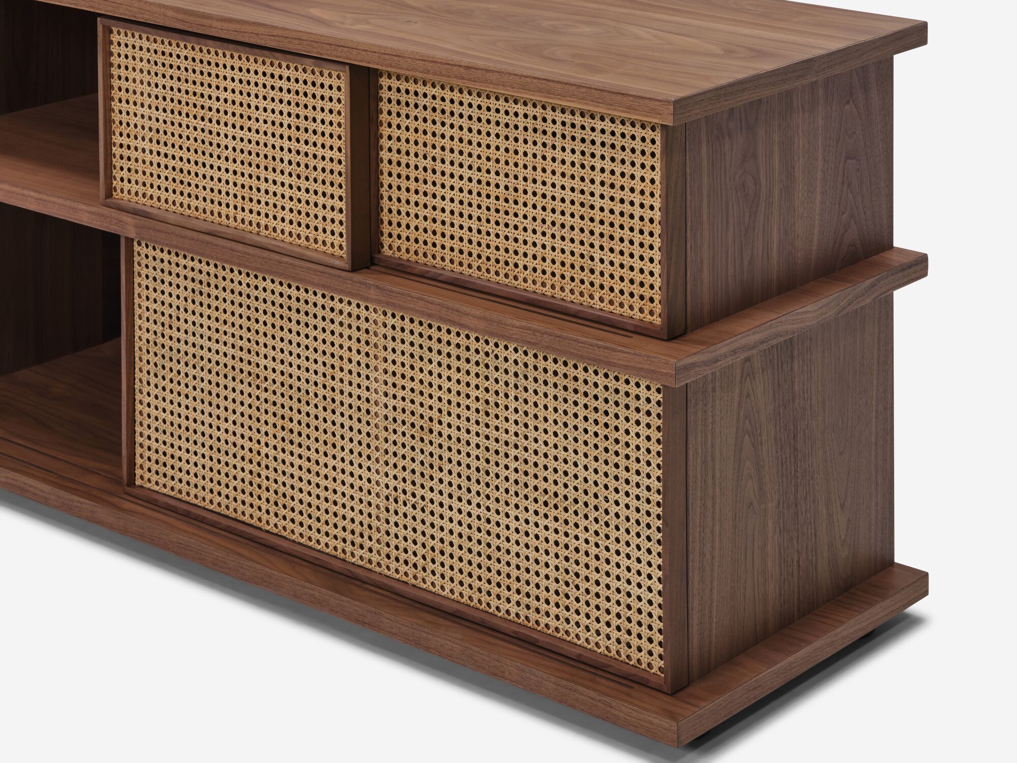 Tall walnut media unit with natural cane doors detail view