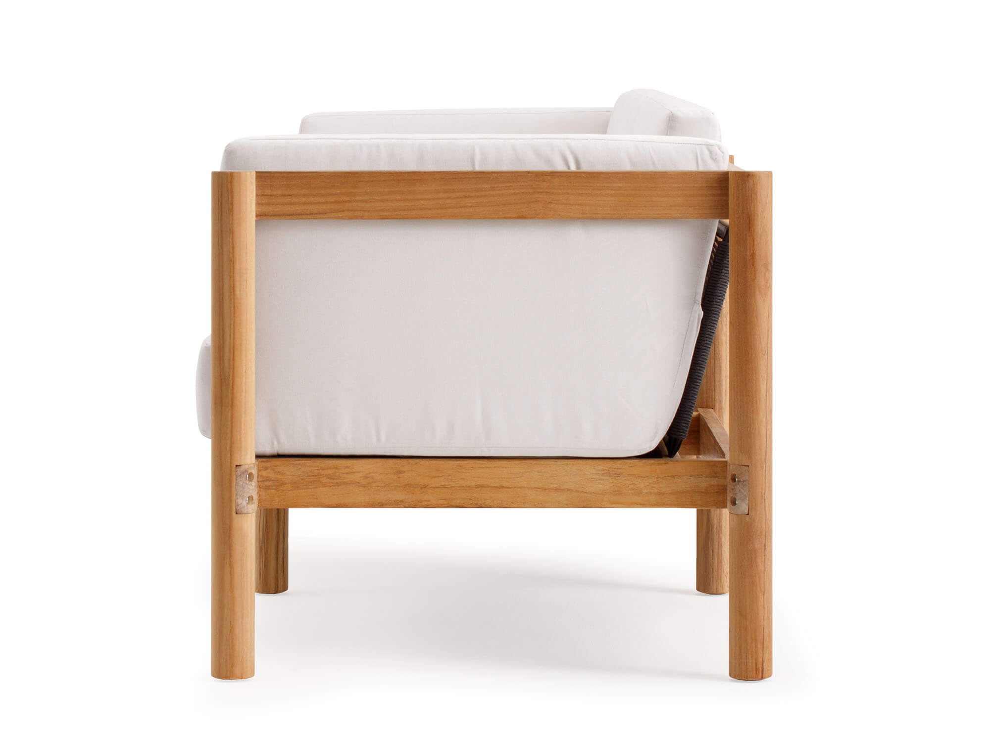 Side view of outdoor armchair with white cushions and wood legs