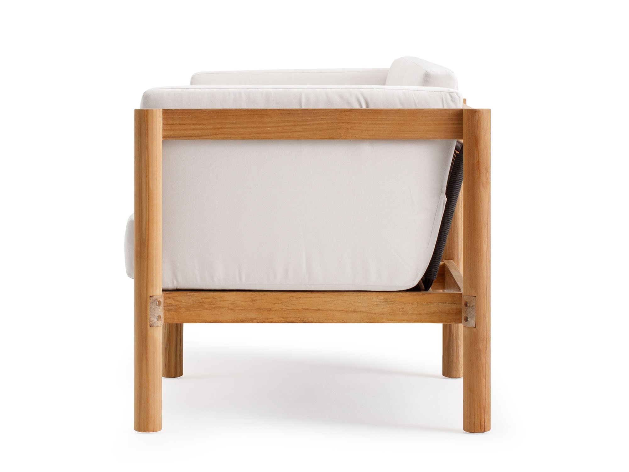 Side view of outdoor armchair with white cushions and wood legs