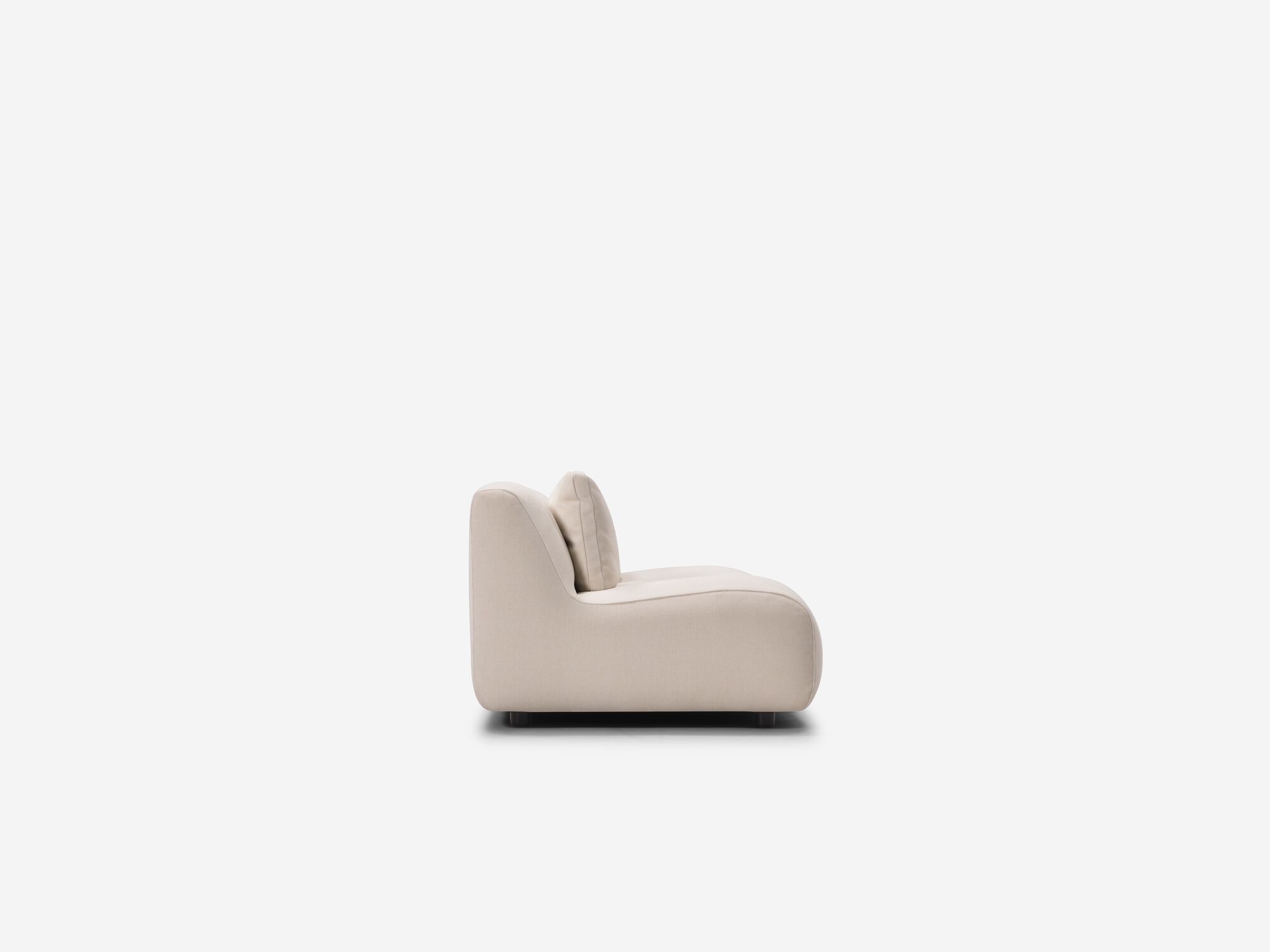 Side view of beige armless loveseat