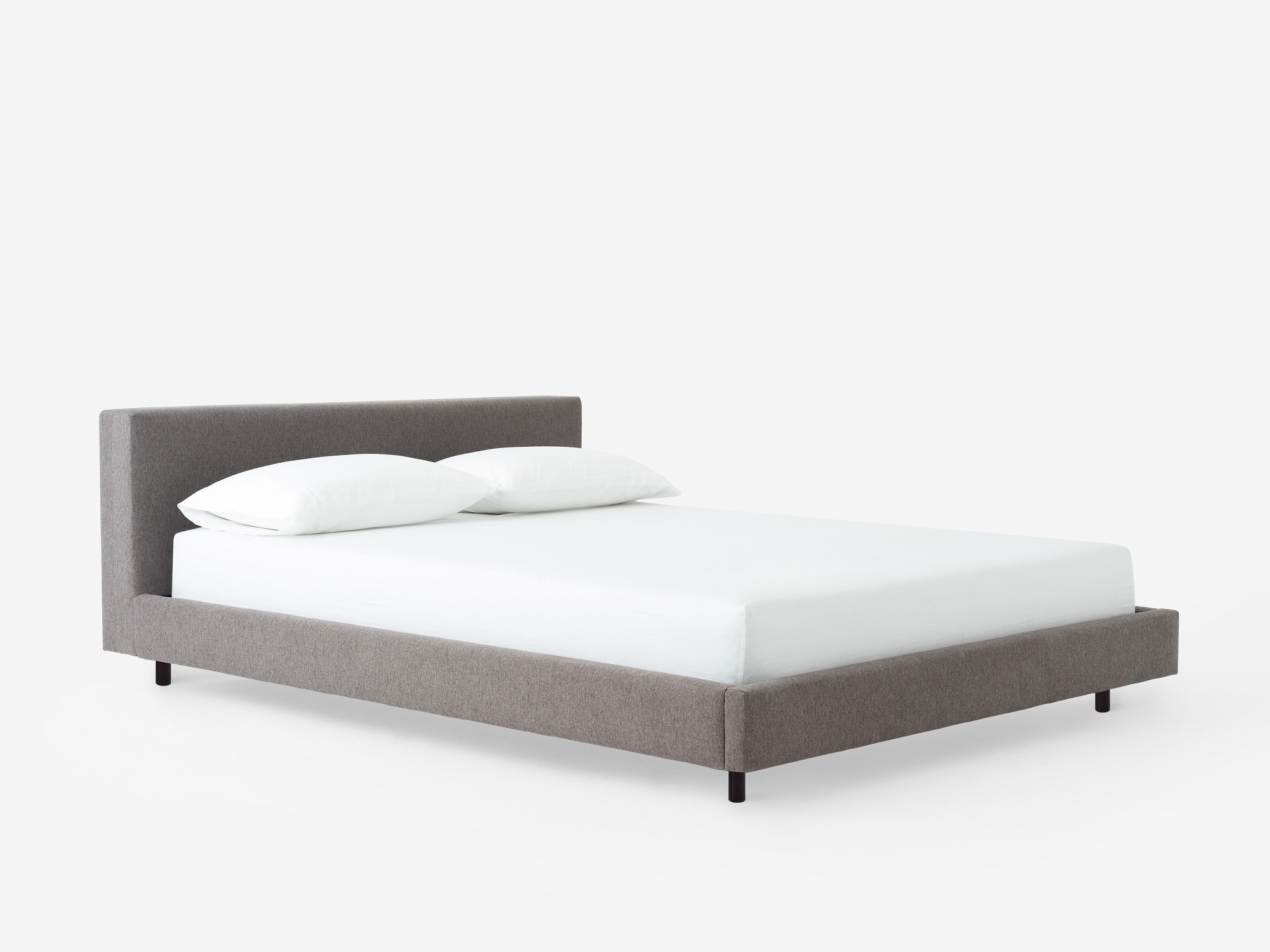 Corner view of the Bento platform bed frame in grey fabric