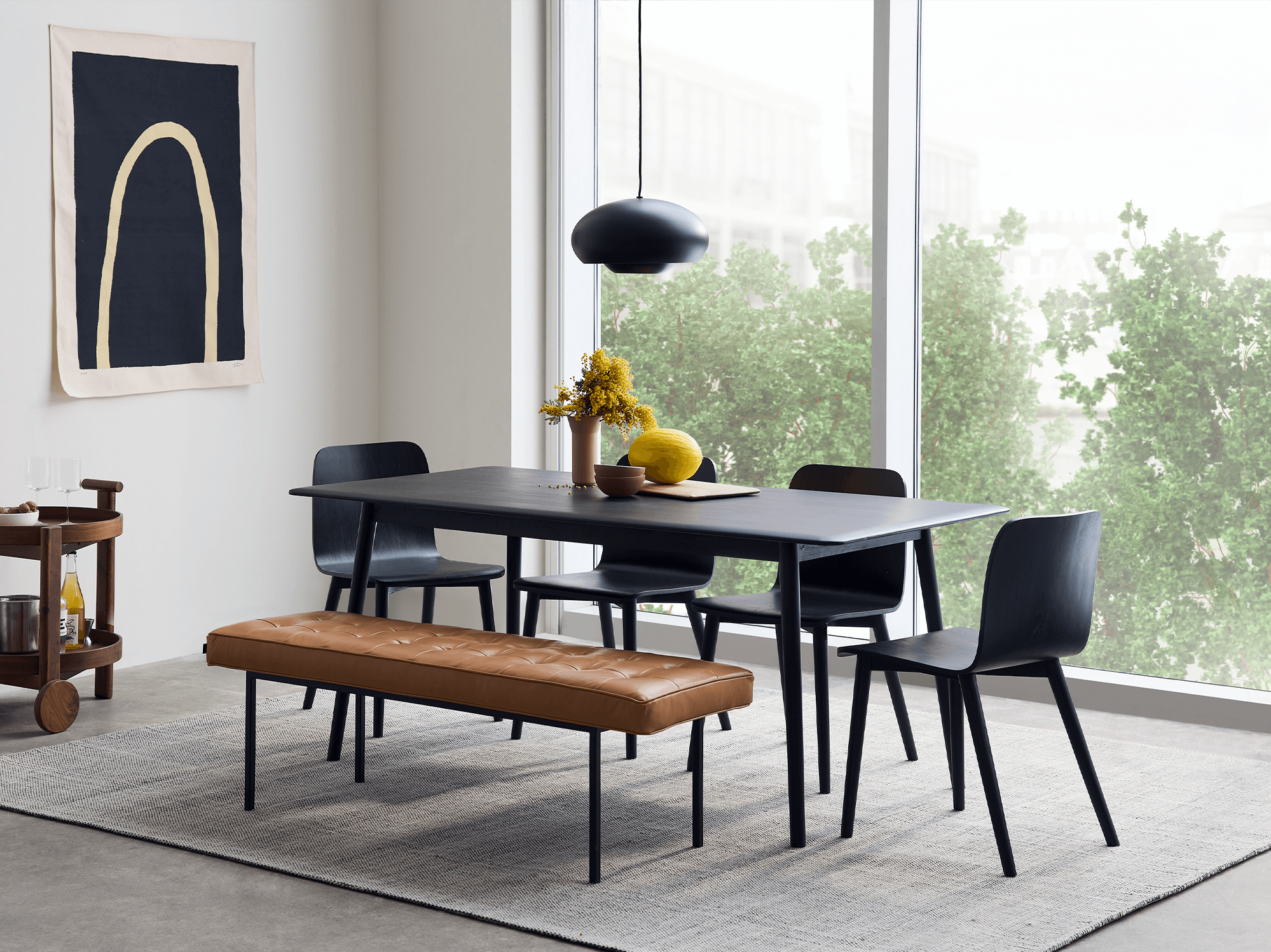 wood and black dining table with bench