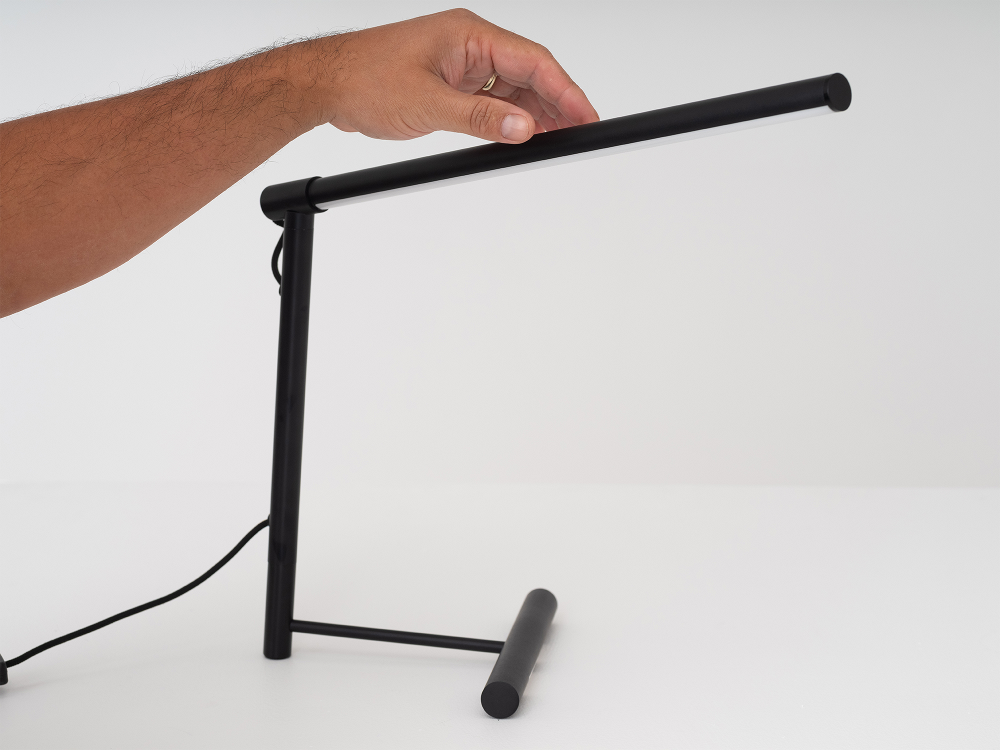 Detail view of the Slimline modern office desk lamp in black