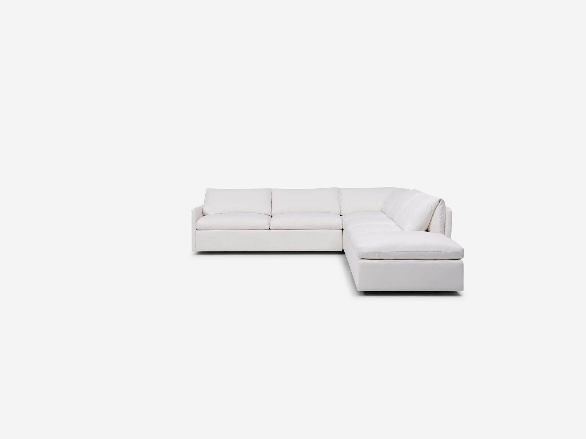 Front view of white sectional sofa with narrow arms and right hand chaise