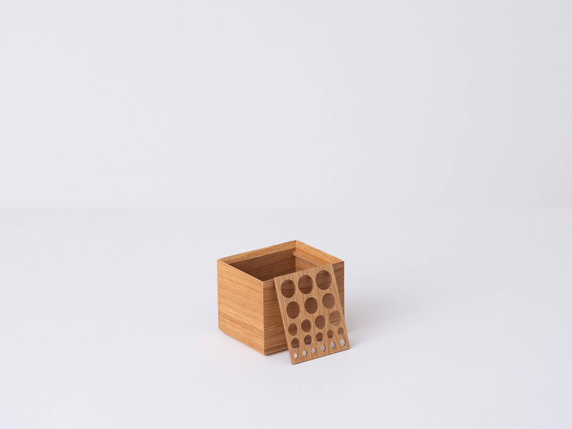 Angled view of the wooden Draft Tall Storage box with top off