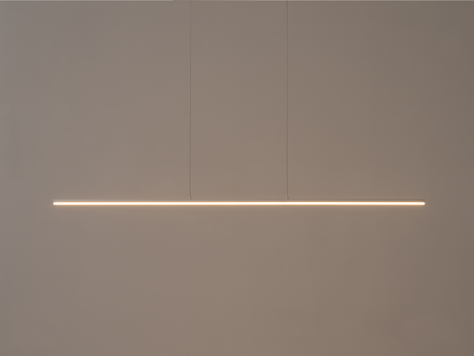 The large Slimline pendant light in white with light on