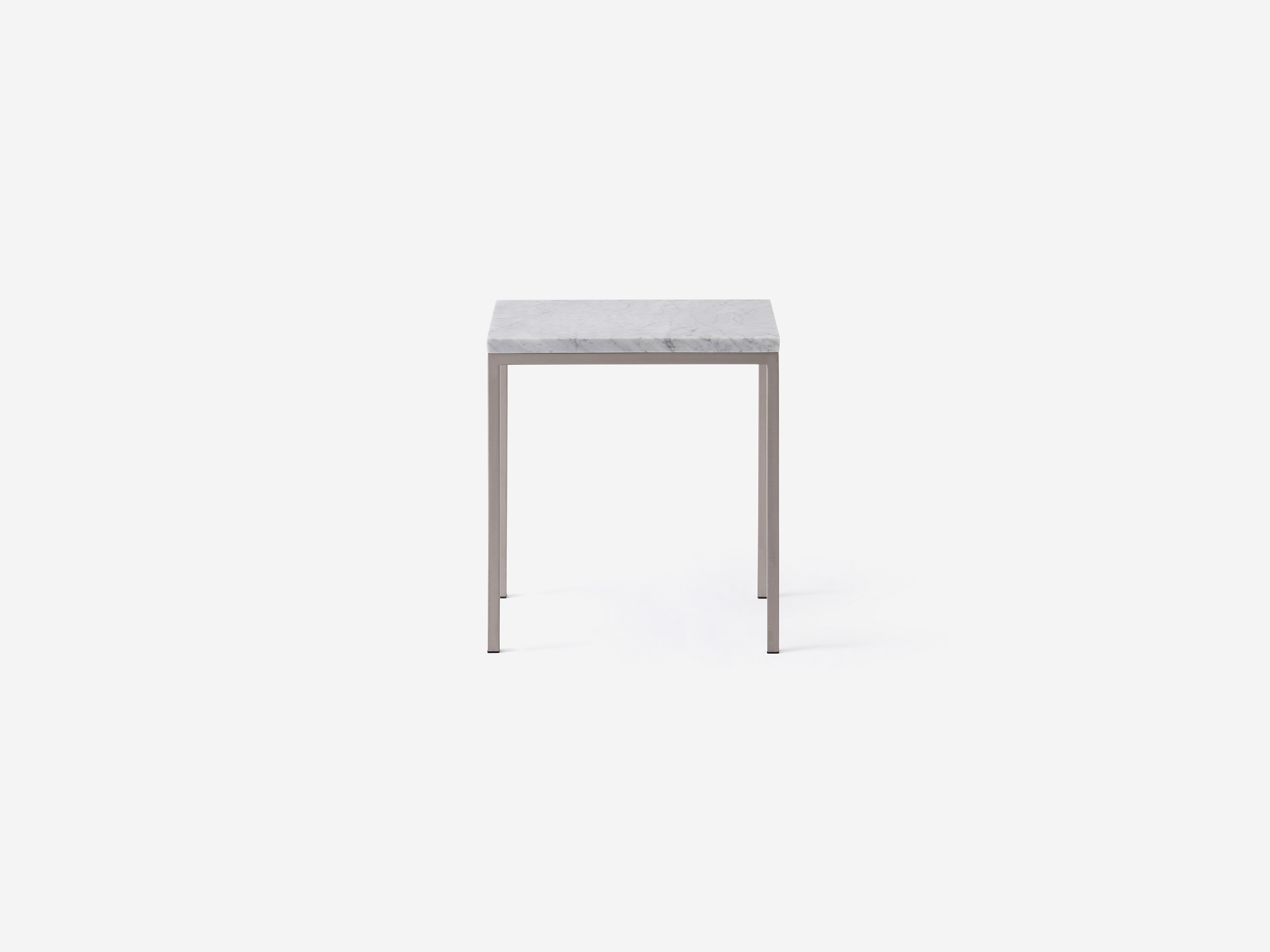 Front view of white marble top and stainless steel end table