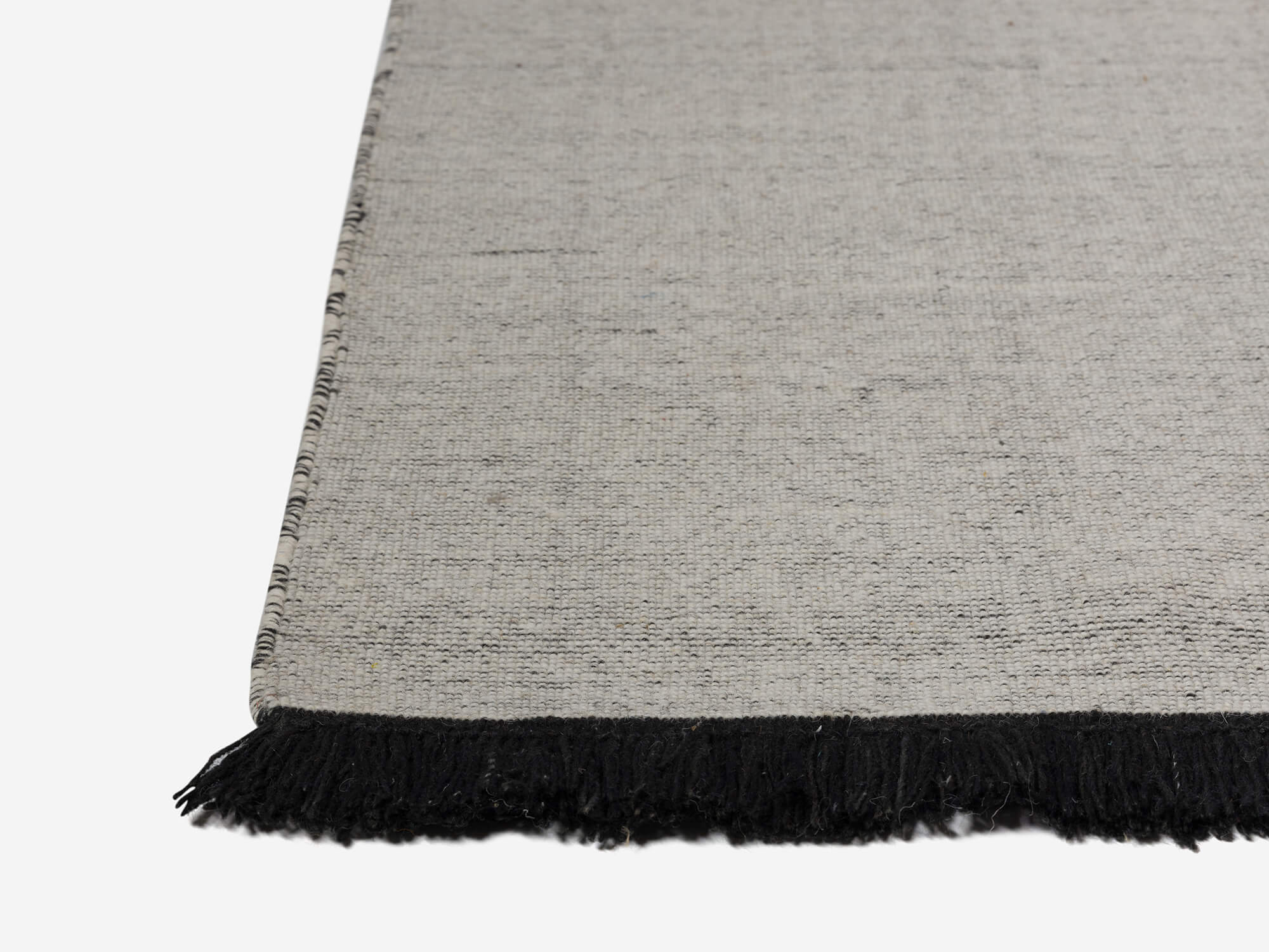 Large grey braided wool rug detail view