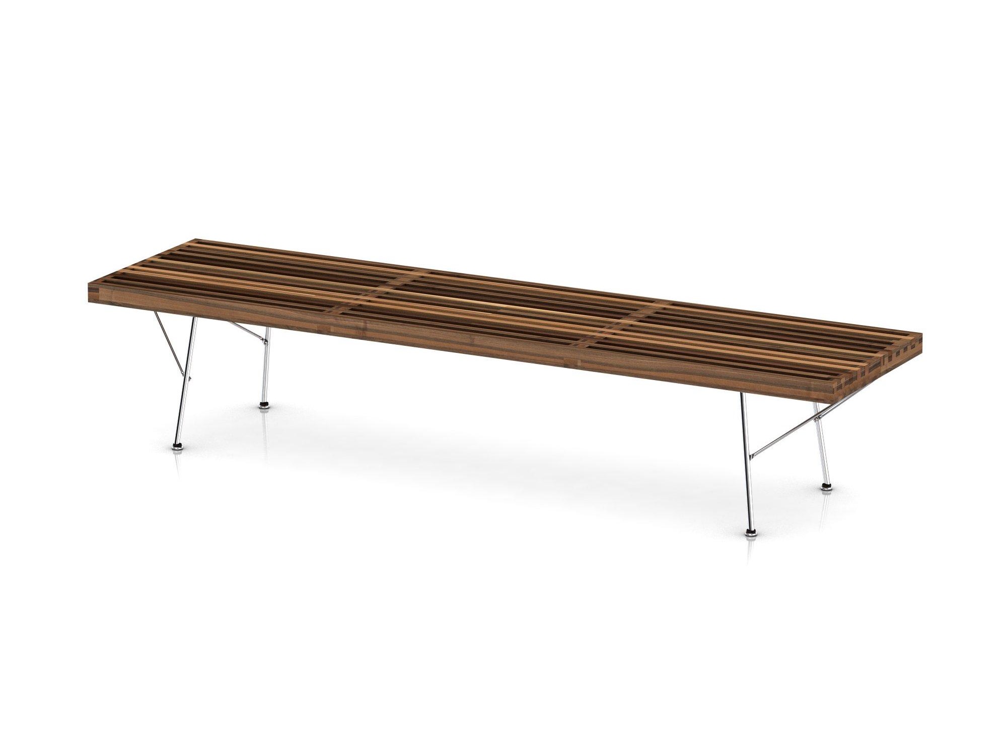 Right angle view of large walnut bench with chrome legs