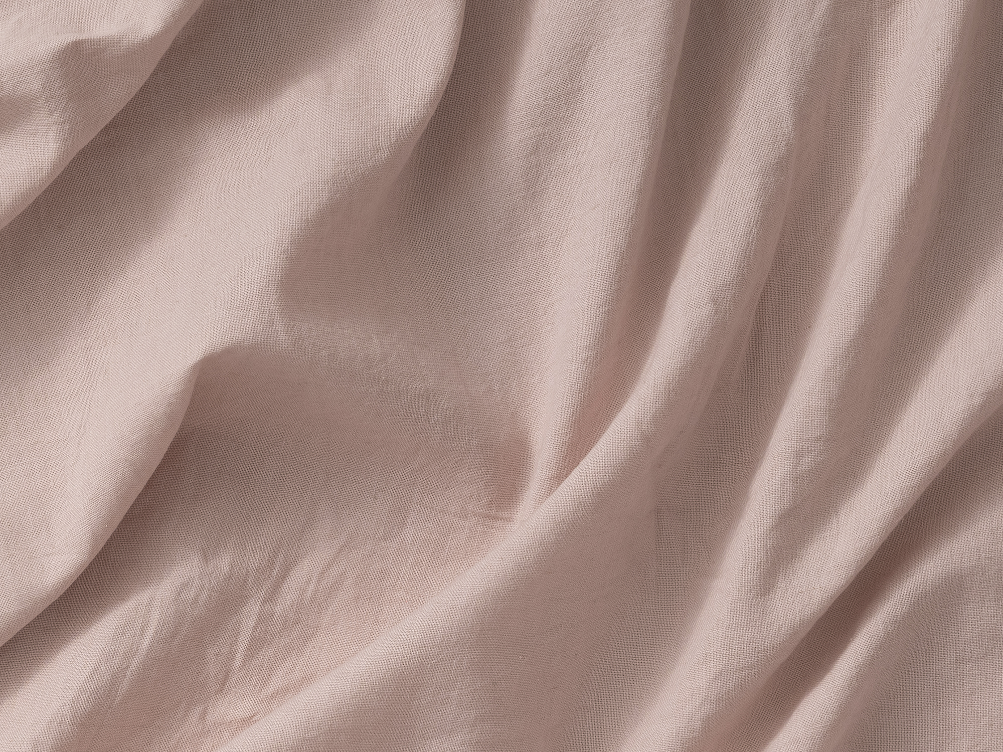 Detail view of linen cotton sheets in beige