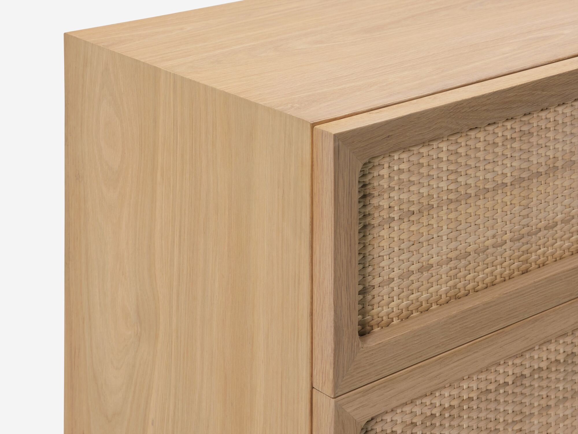 Top detail view of oak chest with woven drawer fronts