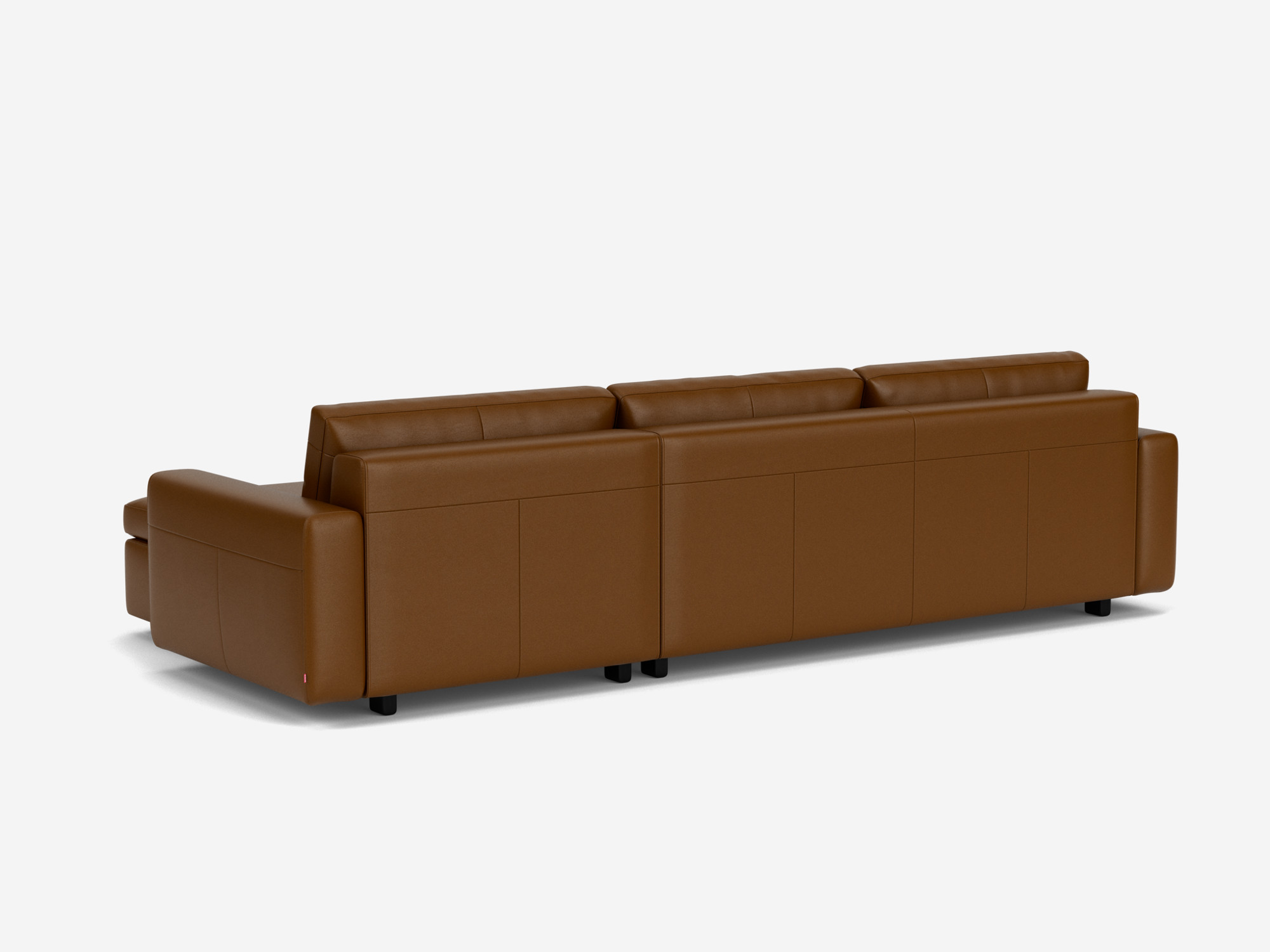 Back view of the brown leather Reva modern sectional with right hand facing chaise