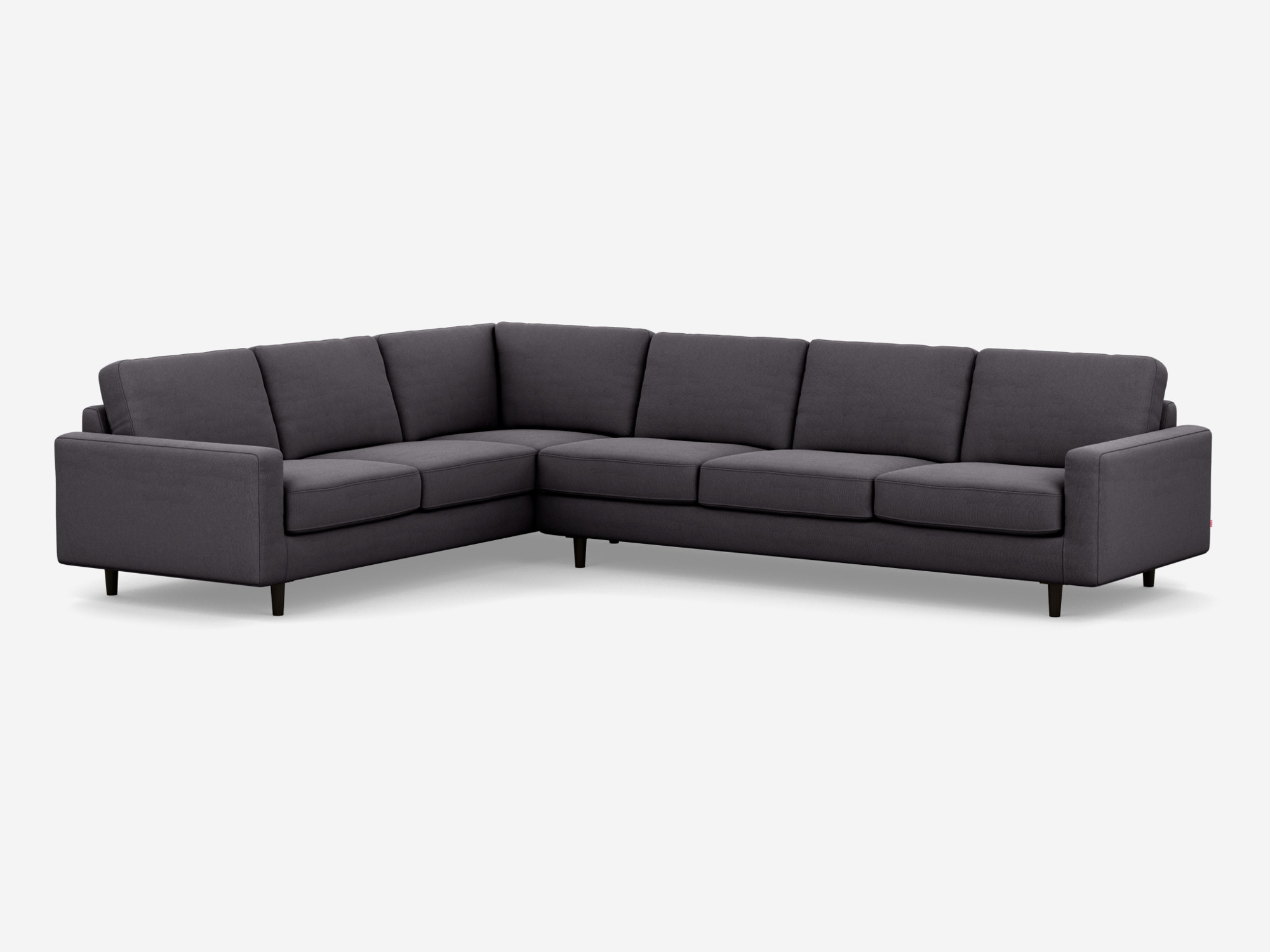 Corner view of the Oskar left hand facing l shape sofa in dark grey fabric