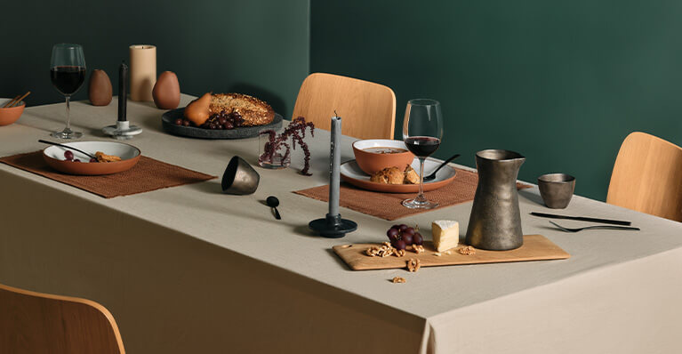 group of dining accessories are shown on top a dining table. Link to gift category