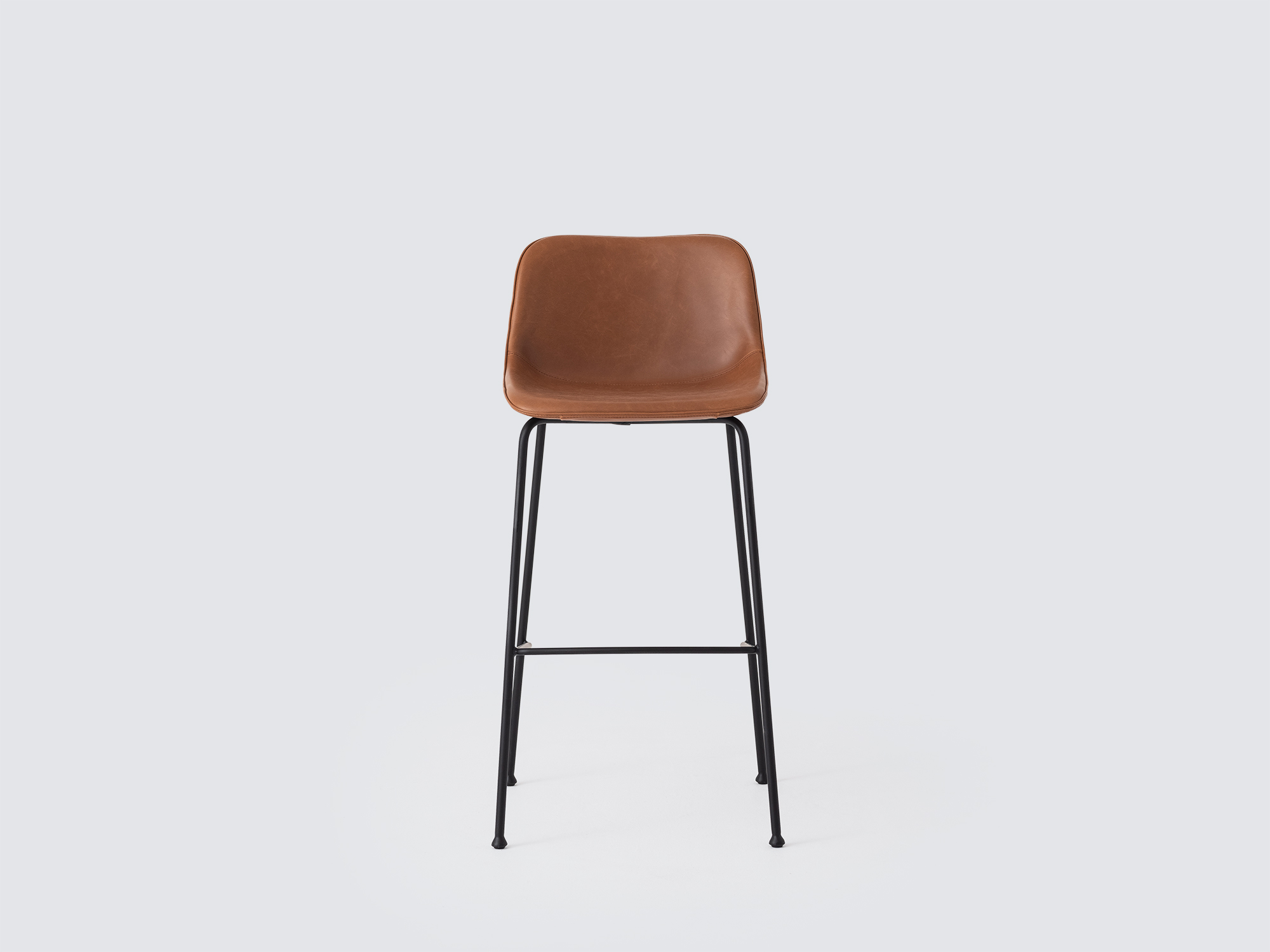 Front view of the Oles counter height bat stool with brown leather seat